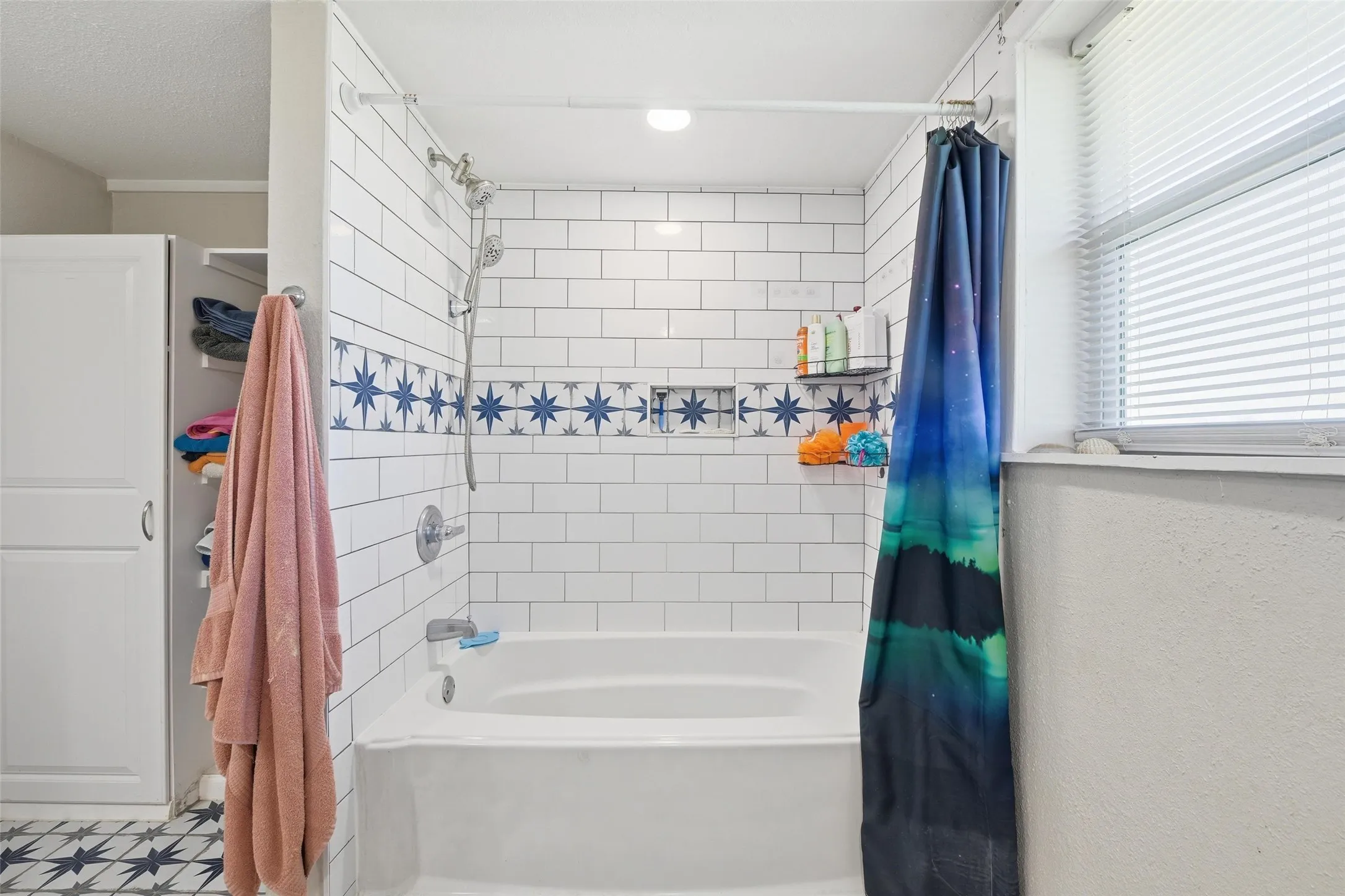 Full bathroom featuring shower / bathtub combination with curtain