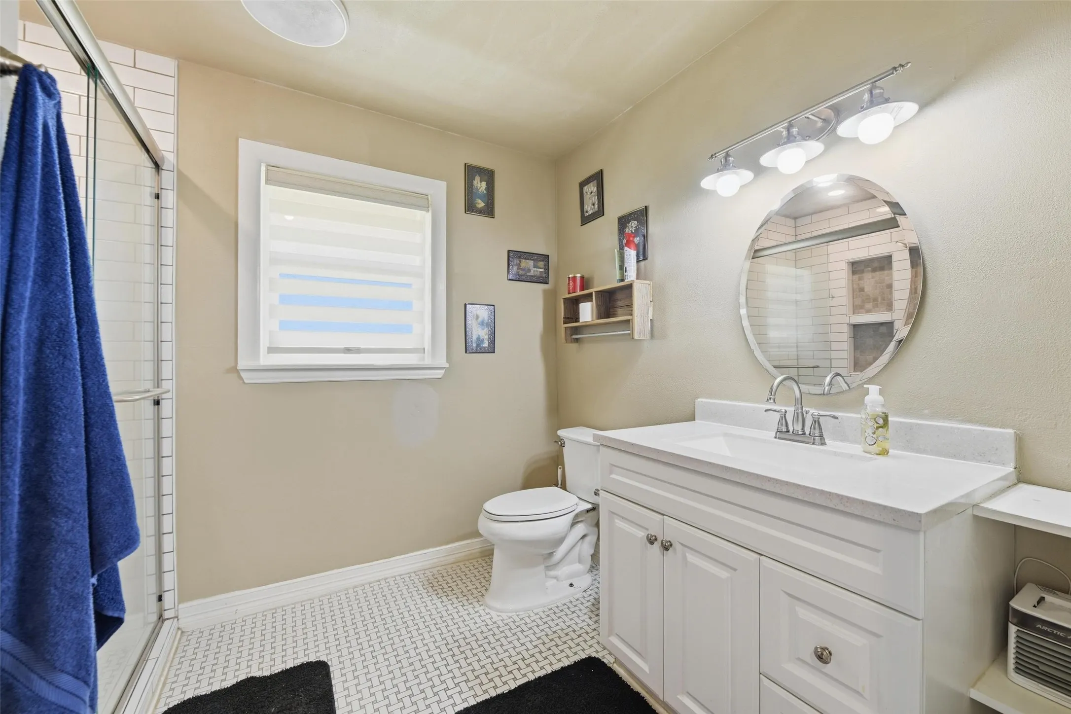Bathroom with vanity and a shower stall