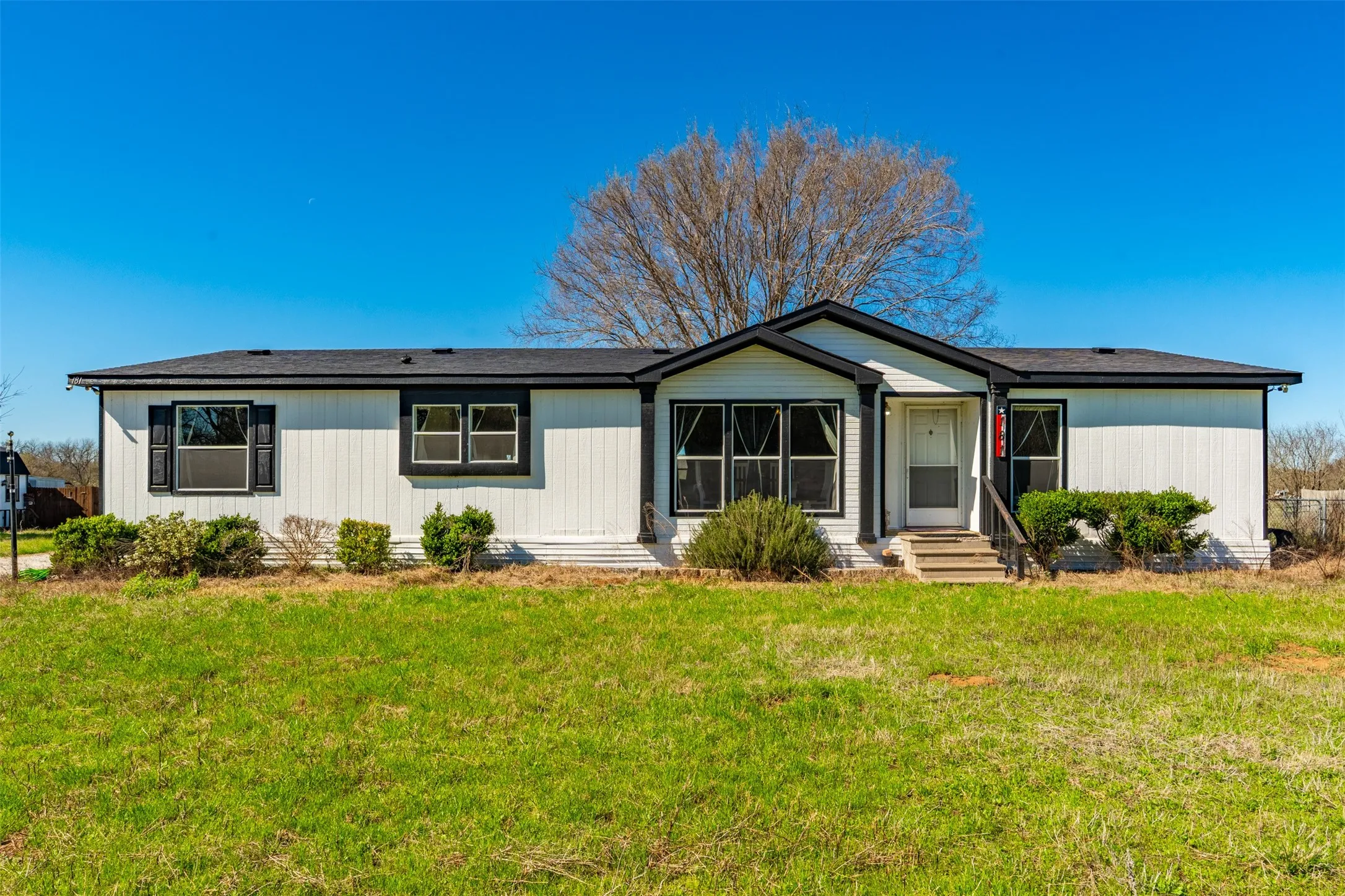 Exterior of updated modular home on 13 acres at 181 Private Road 125 in Whitney TX