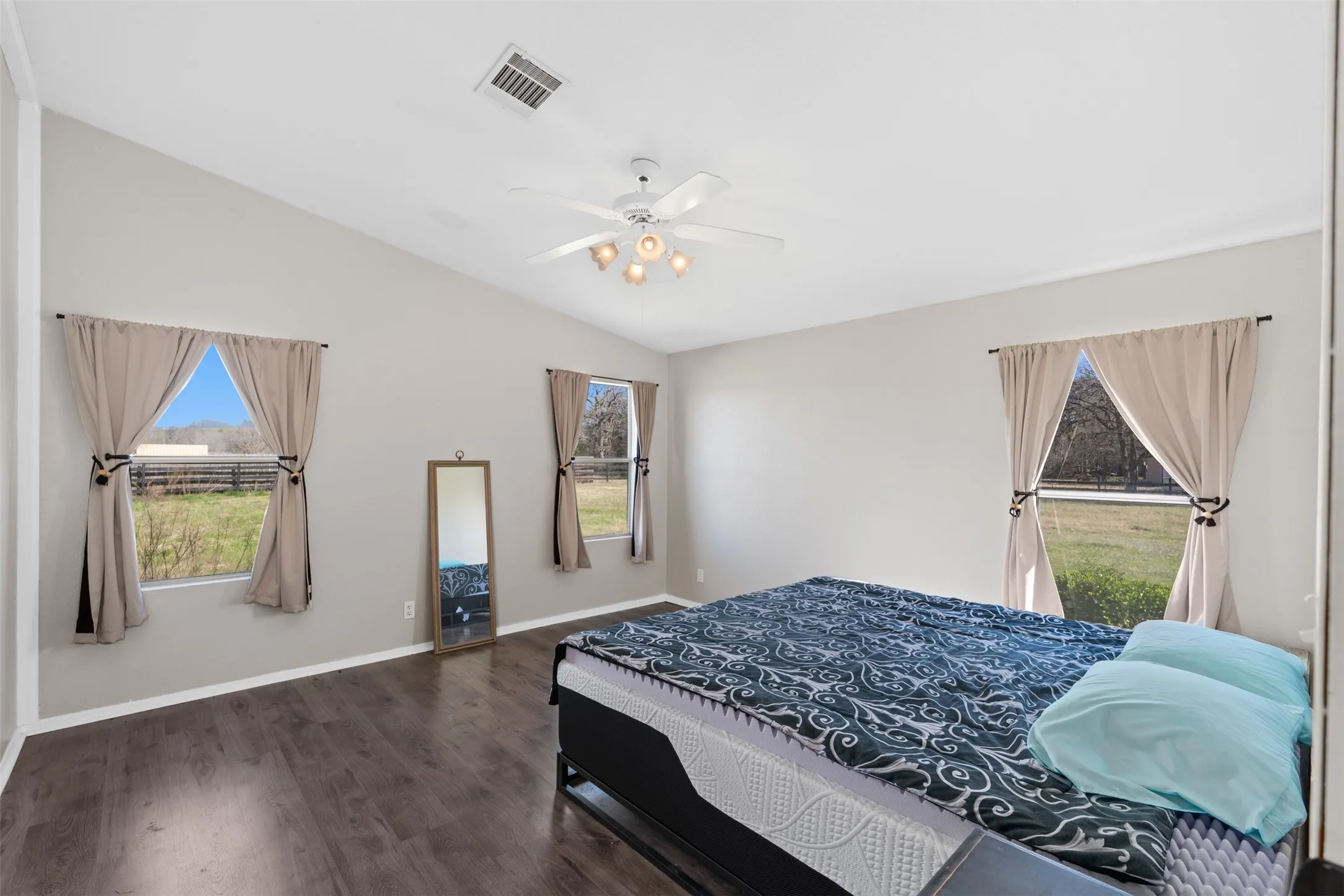 Primary bedroom in Whitney TX 3 bedroom home with fresh paint and natural light