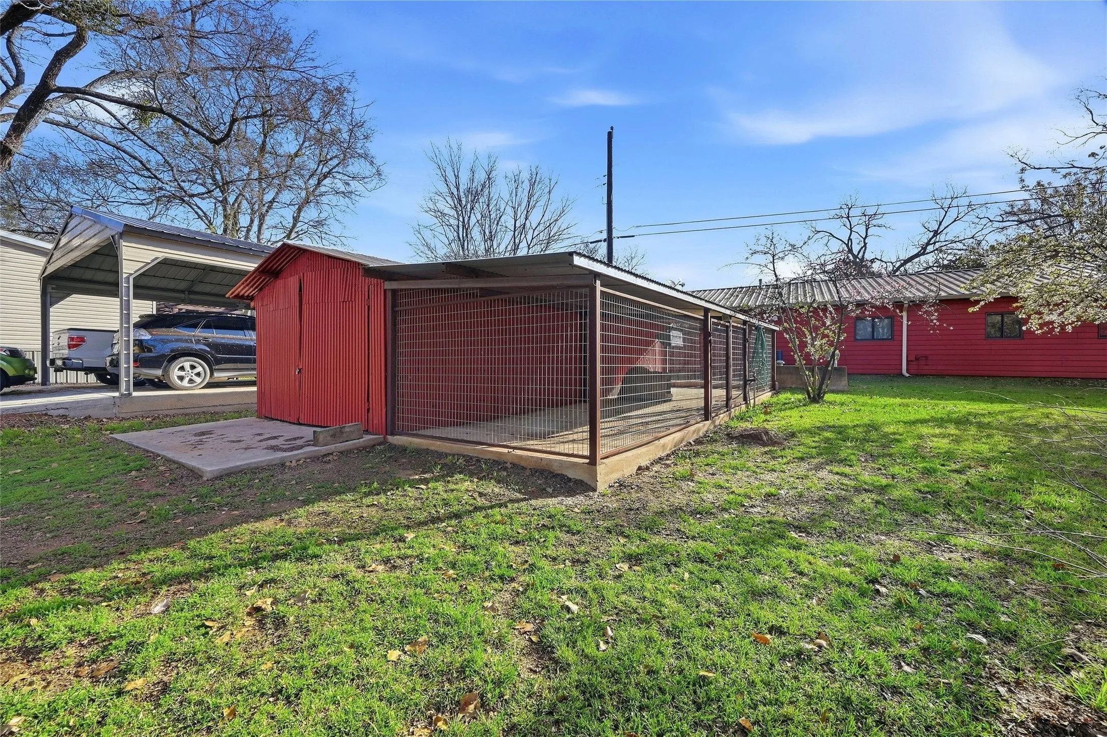 storage building with shaded dog kennel
