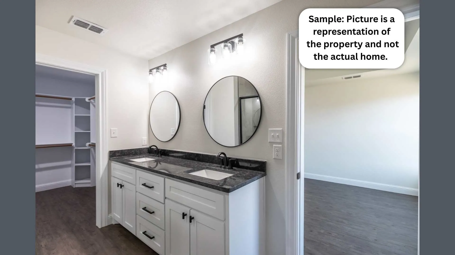 Full bathroom featuring double vanity, a walk in closet, and dark wood finished floors