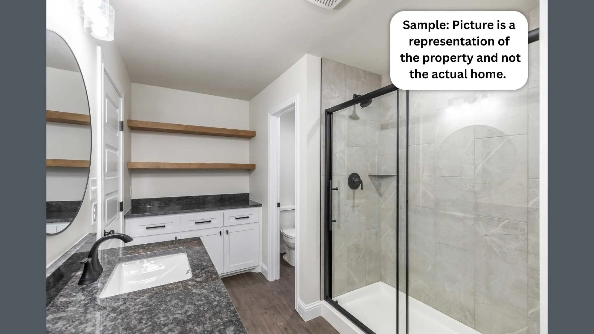 Full bathroom featuring vanity, a shower stall, and dark wood finished floors