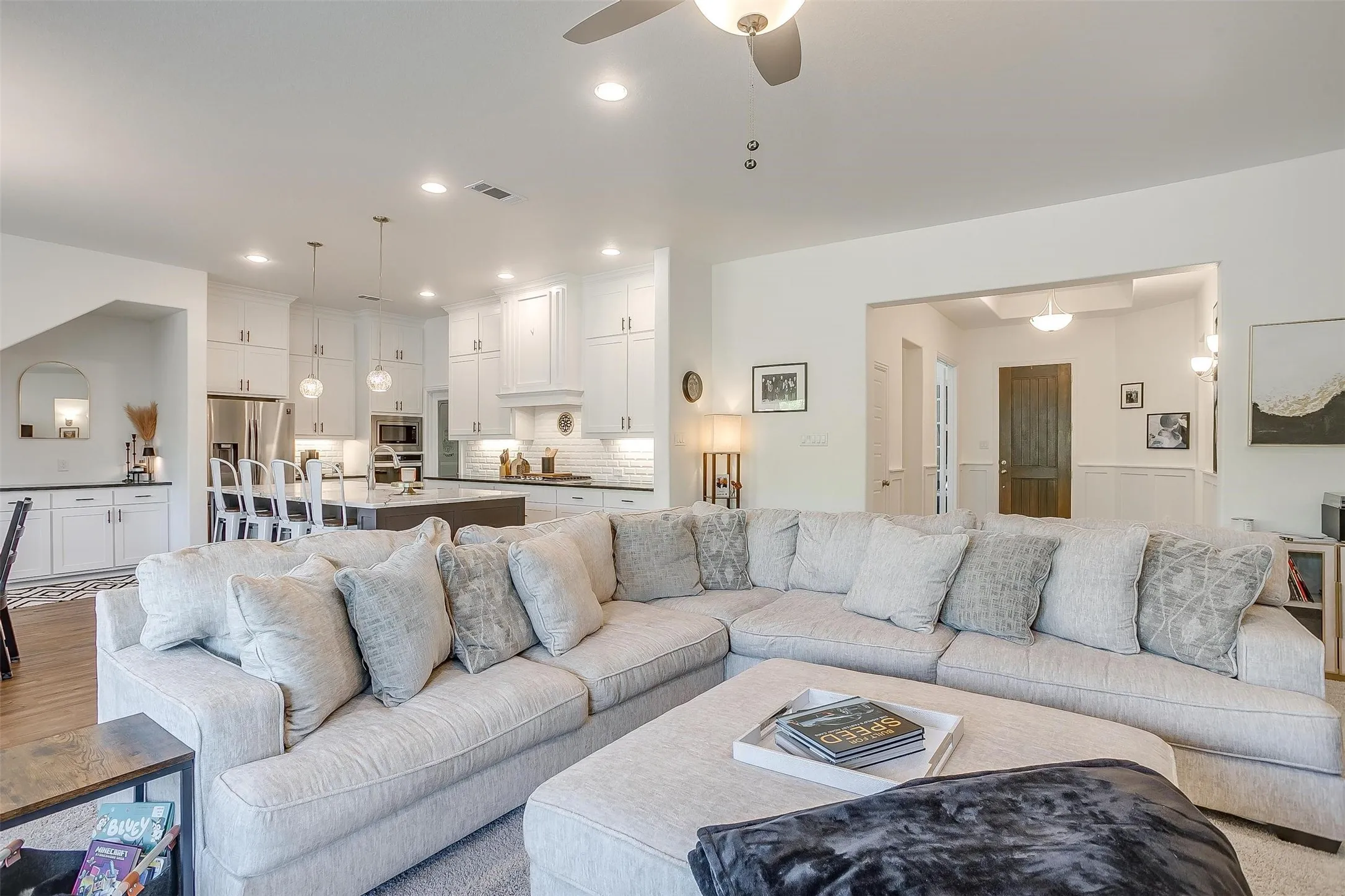 The living area is open to the extravagant kitchen with a generous amount of Chef-prep countertop space as well as built-in cabinets.