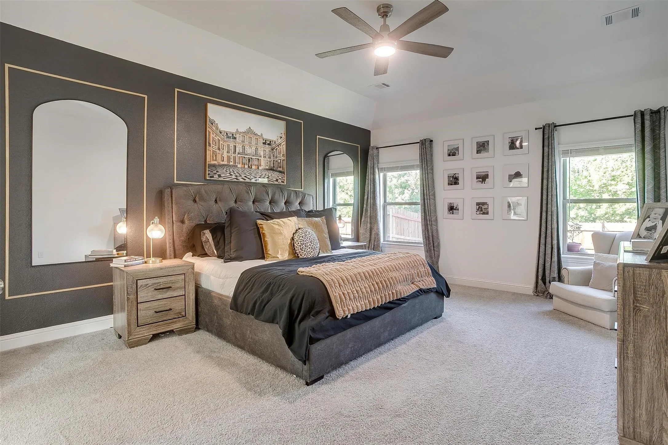 Primary bedroom has the exquisite back yard views to the trees beyond the fence.  Plush carpeting for comfort, vaulted ceiling, lighted ceiling fan for energy efficiency and extravagant amount of space for your furnishings! Create a reading area or small office niche -- lots of room for your ideas!