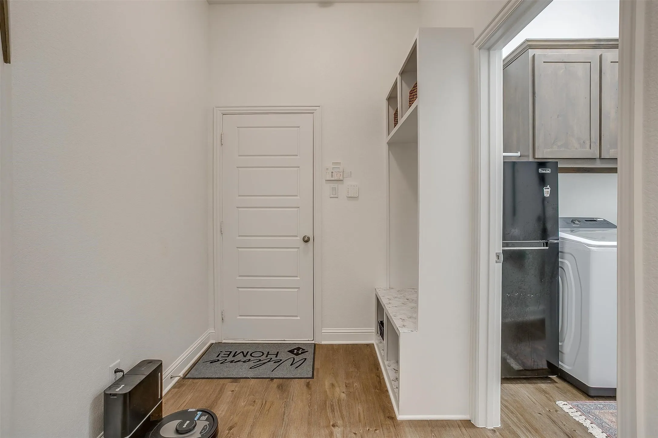 The entry from the garage is a perfectly appointed "mud room" for shoes, back packs, coats and whatever you'd like to store!