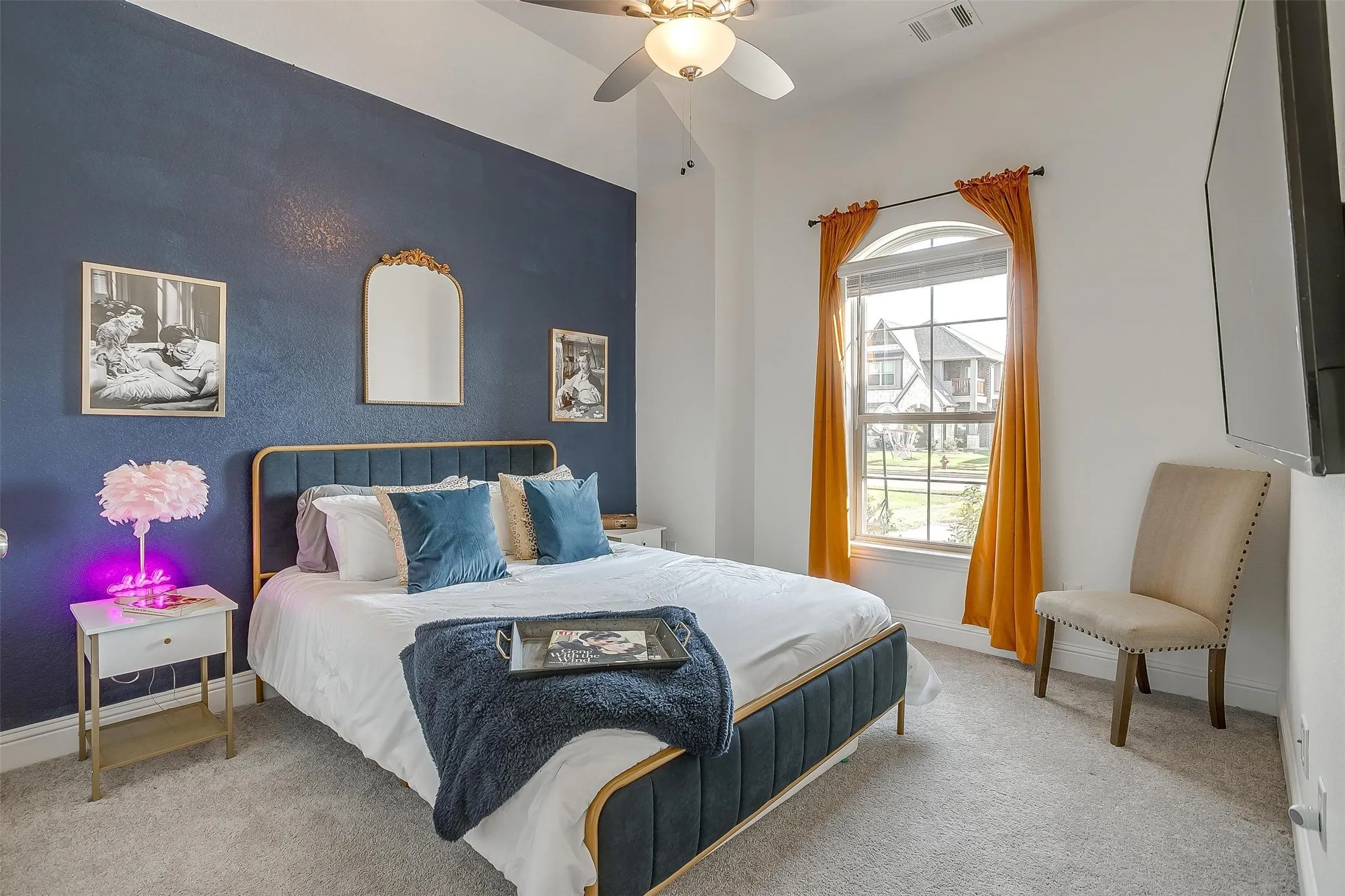 Additional bedroom on first floor perfect for guests or live-in relatives.  Plush carpeting for comfort, natural light from window, lighted ceiling fan for energy efficiency and vaulted ceiling.  Second bath is adjacent for guest comfort.