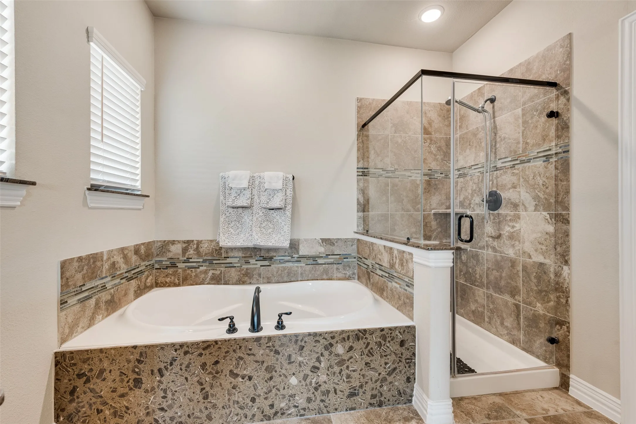 garden tub with separate shower, and walk in closet