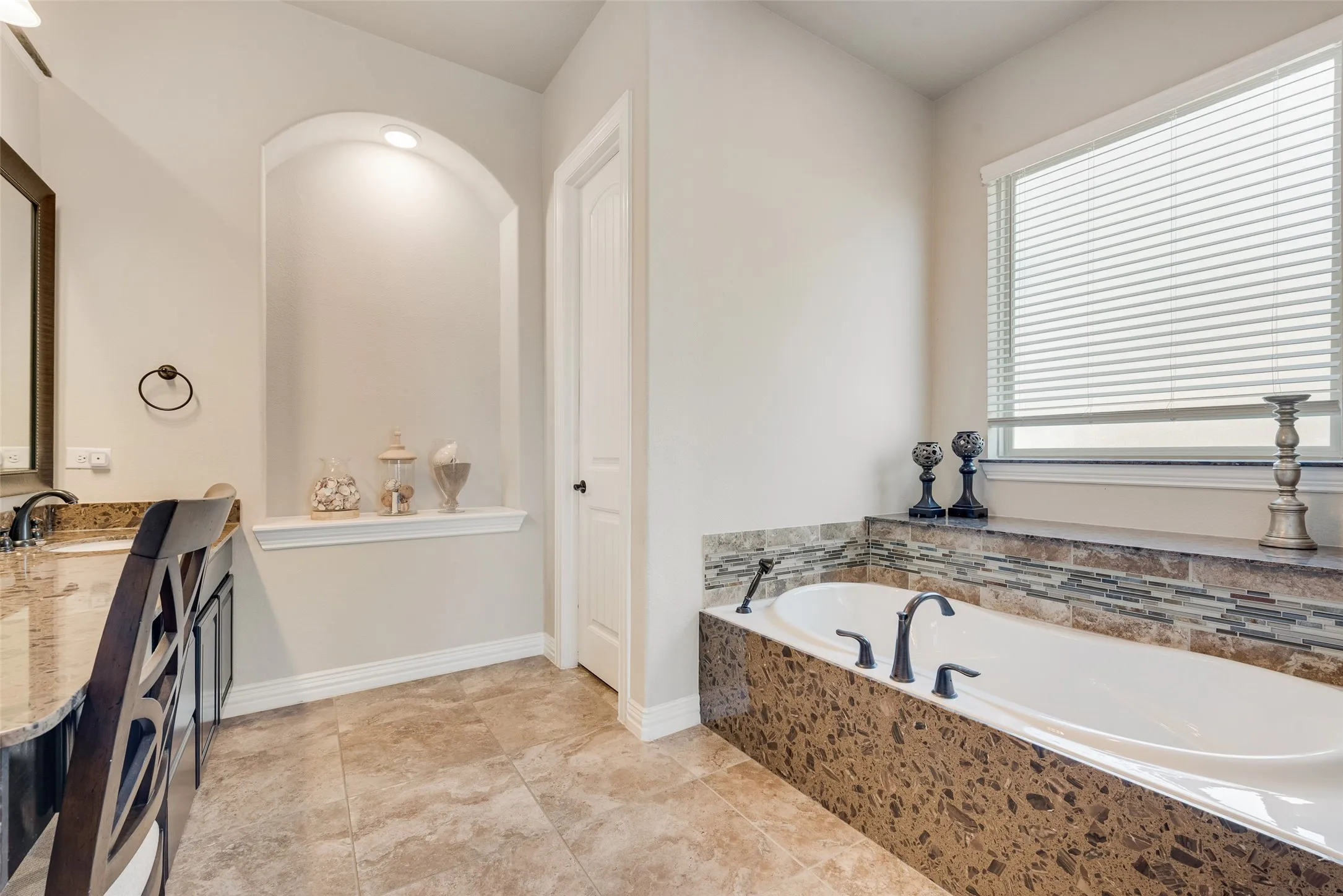primary bathroom with huge garden tub