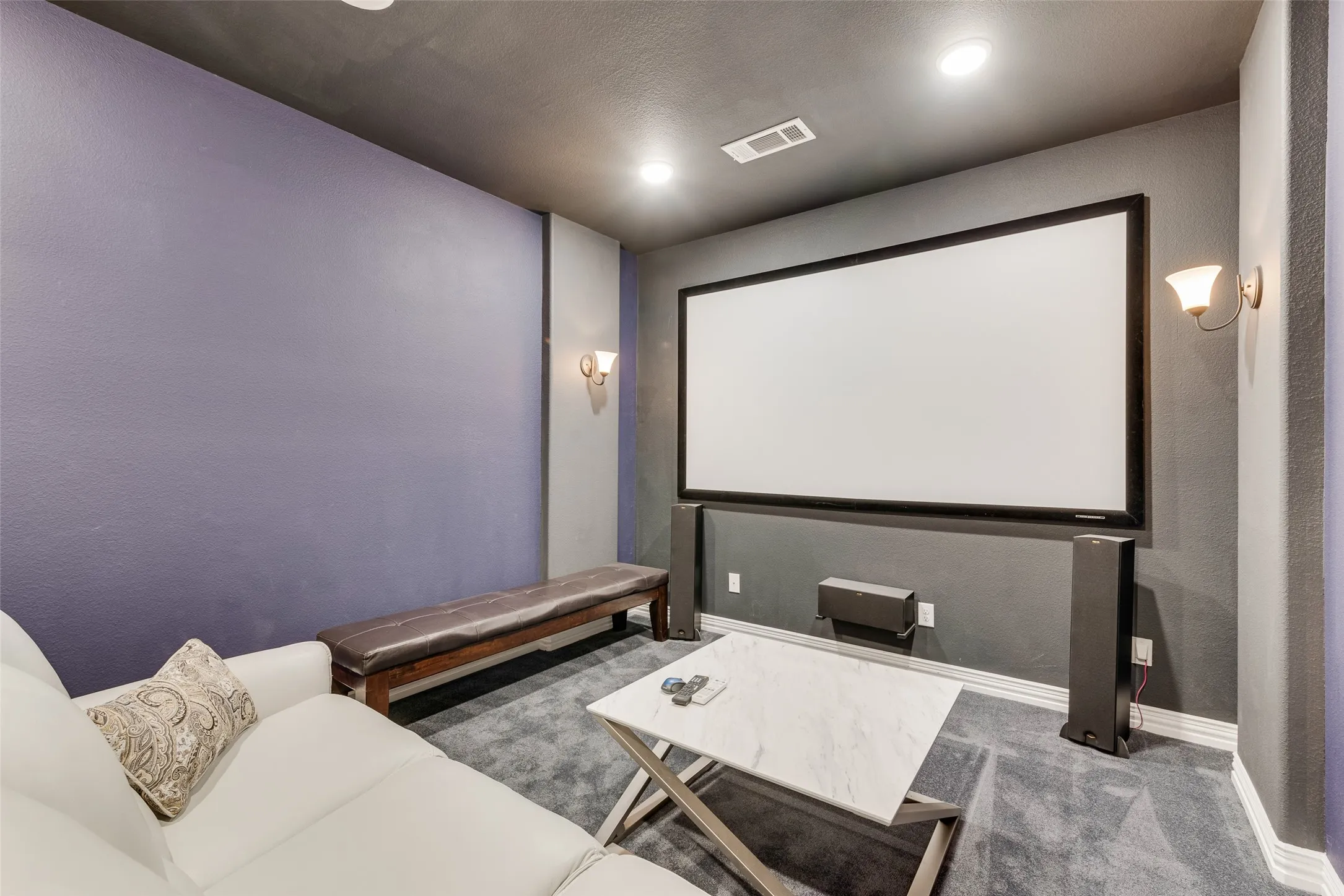 media room with projector, screen, sound system all convey with the property