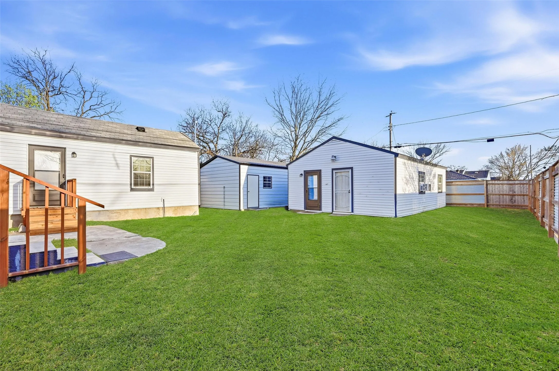 Rear view of house featuring a patio area and an outdoor structure