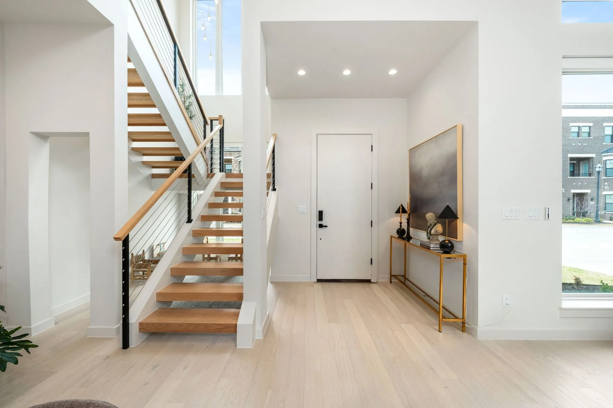 Entryway featuring healthy amount of natural light, light wood-style floors, and recessed lighting
