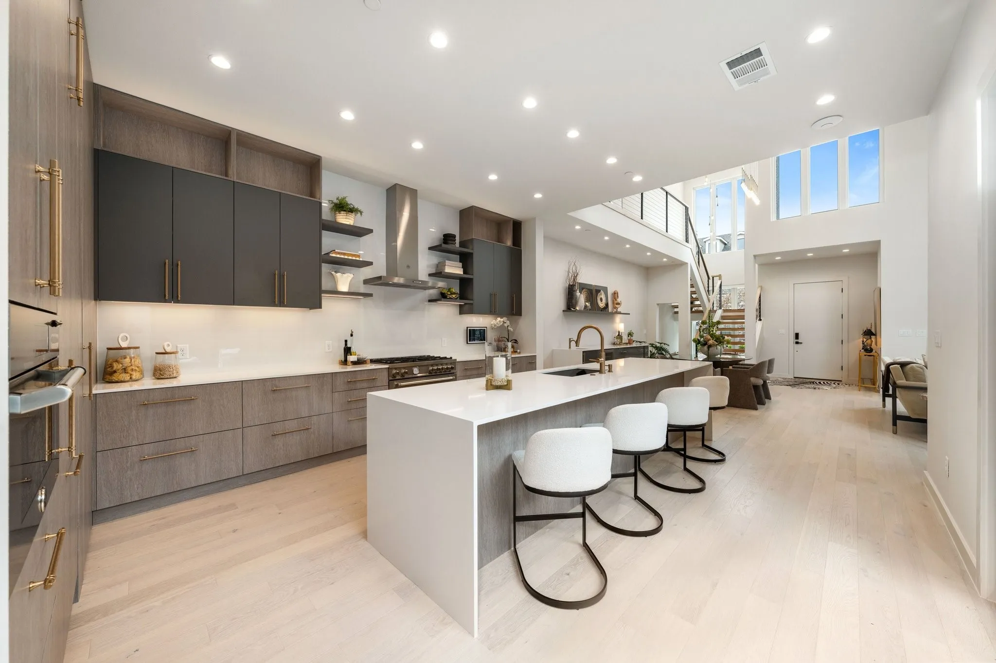 Kitchen featuring gas cooktop, electric oven, microwave/convection oven