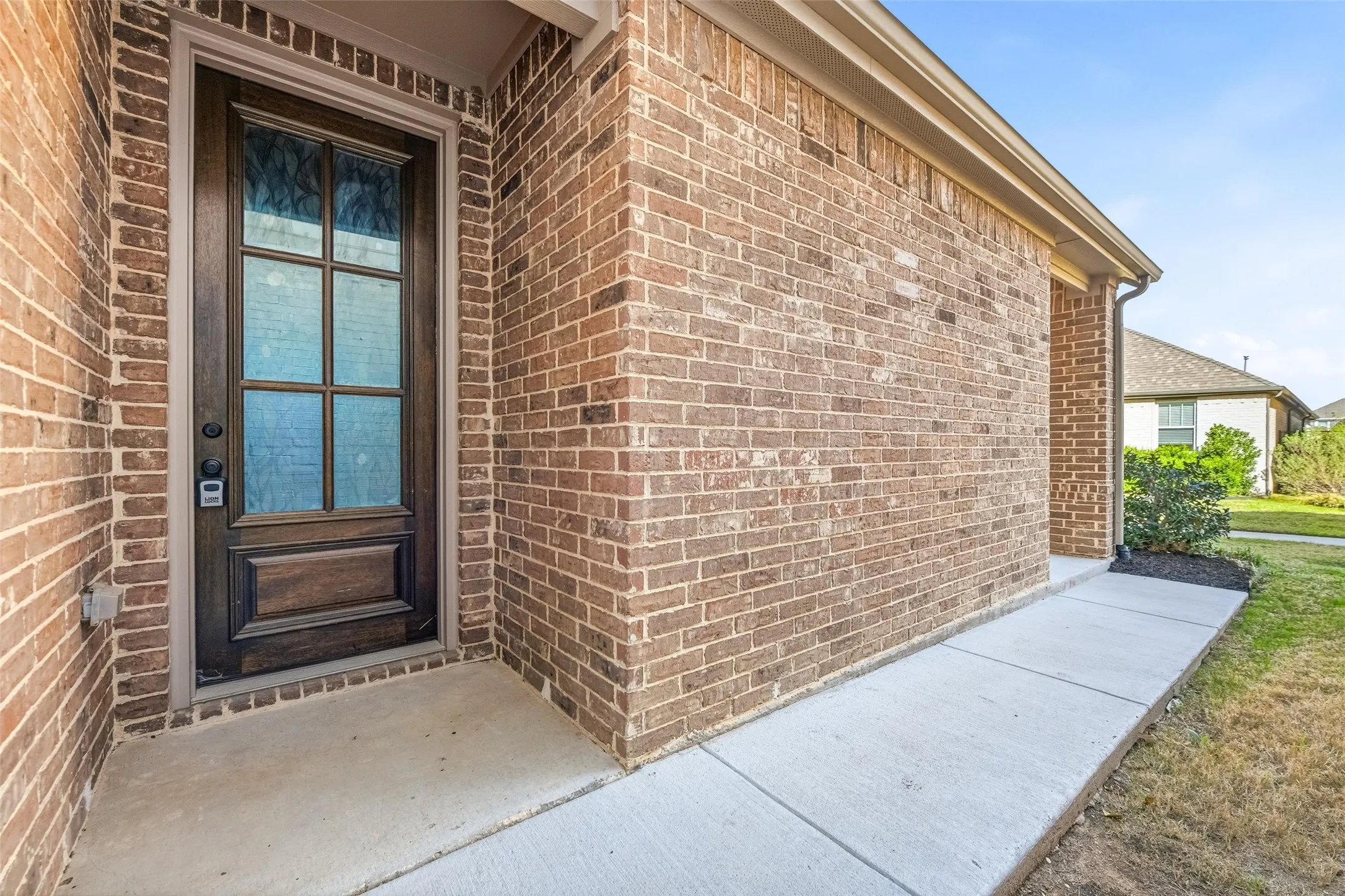 Property entrance with brick siding