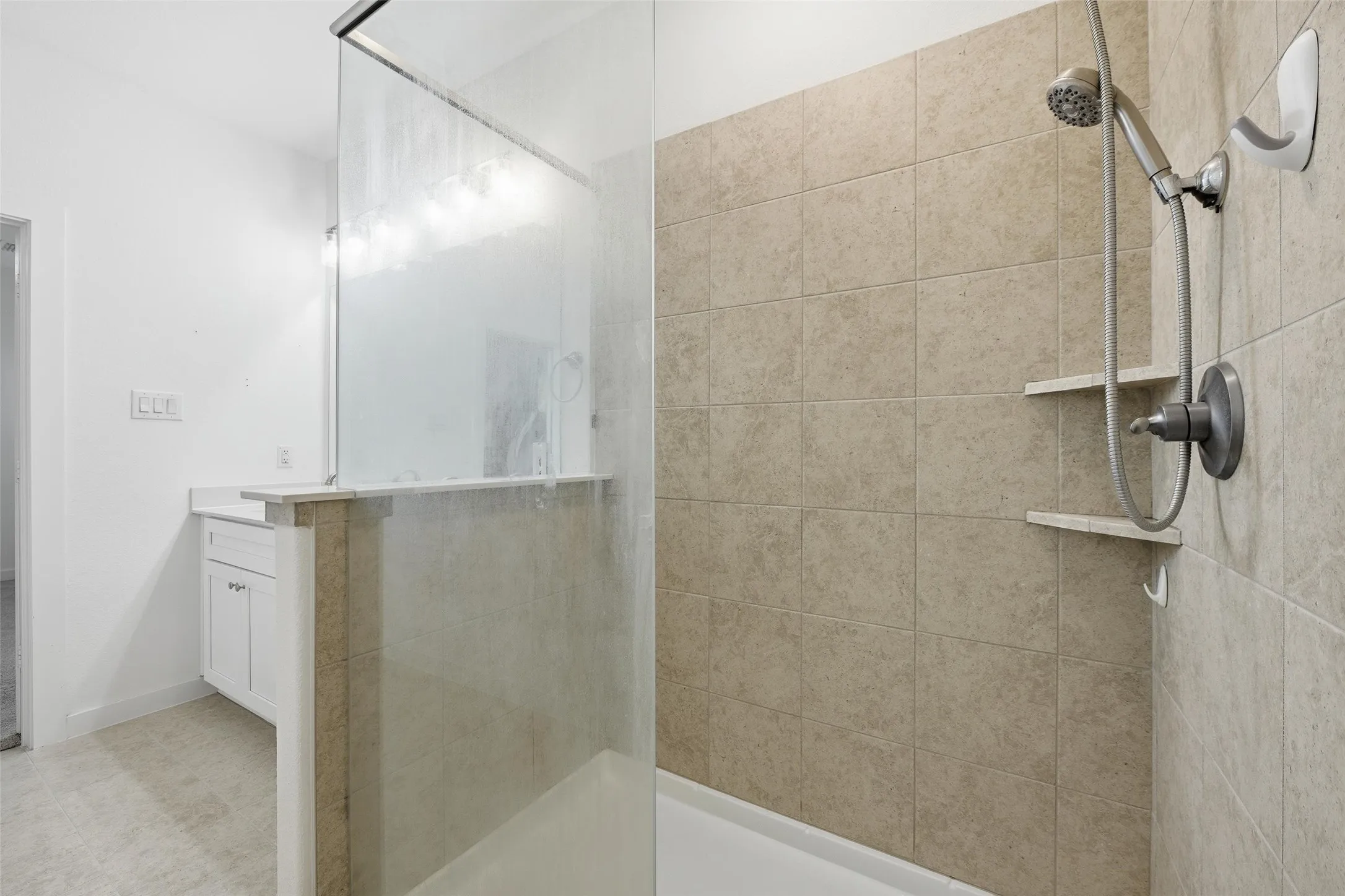Full bath featuring vanity and walk in shower