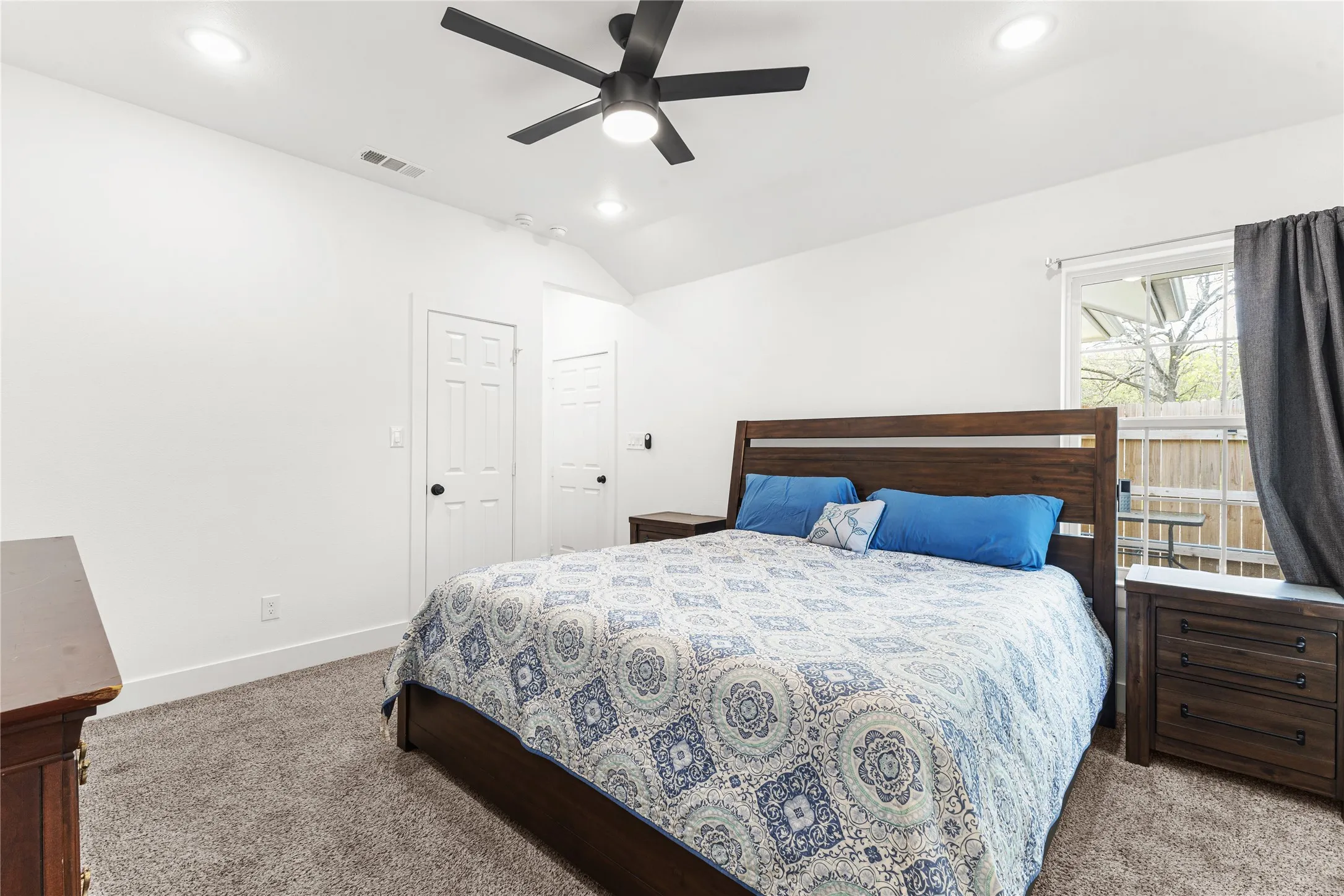 Bedroom featuring carpet floors, a ceiling fan, recessed lighting, and lofted ceiling