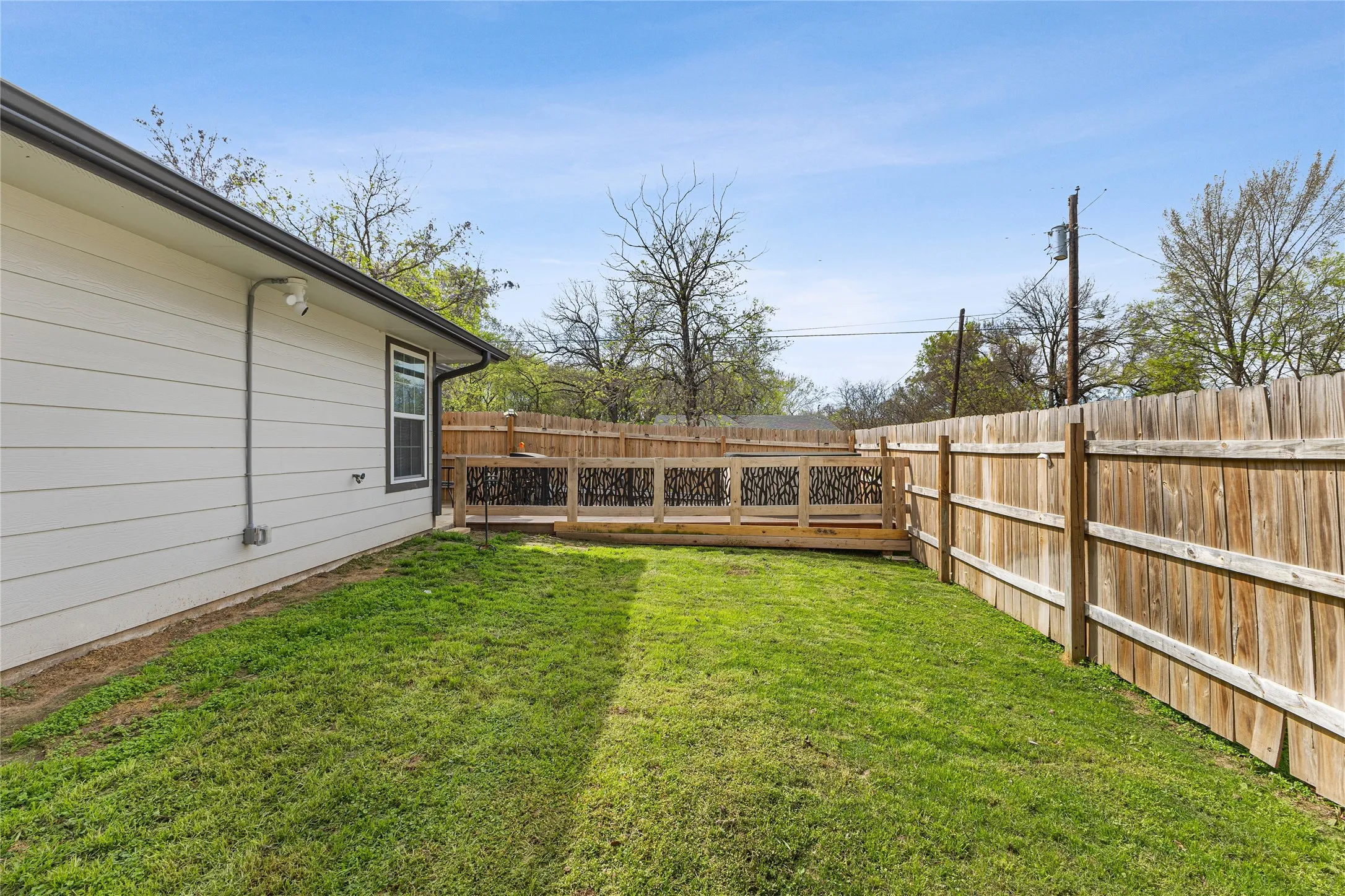 View of fenced backyard