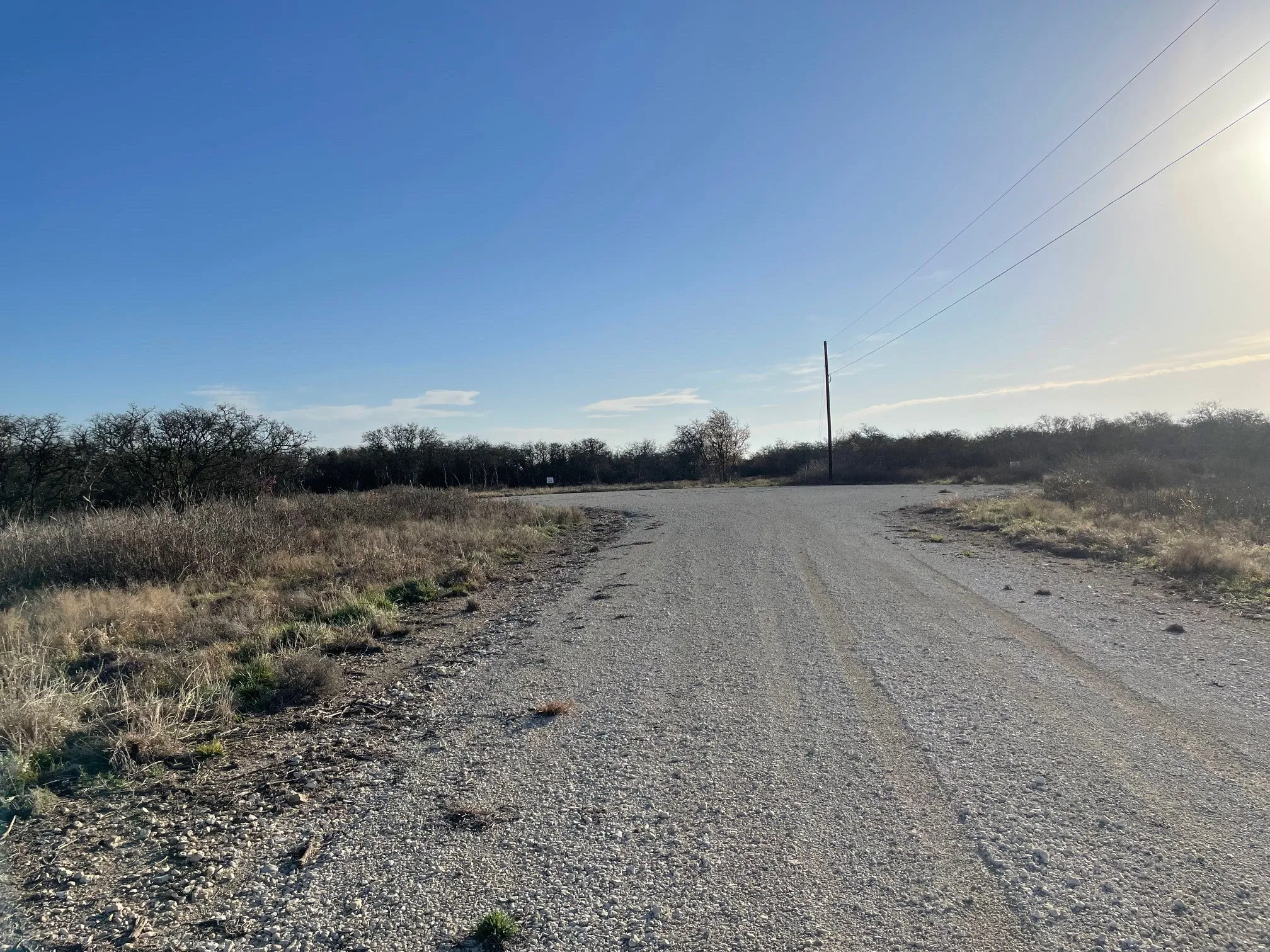 View of dirt / gravel road with a view of countryside