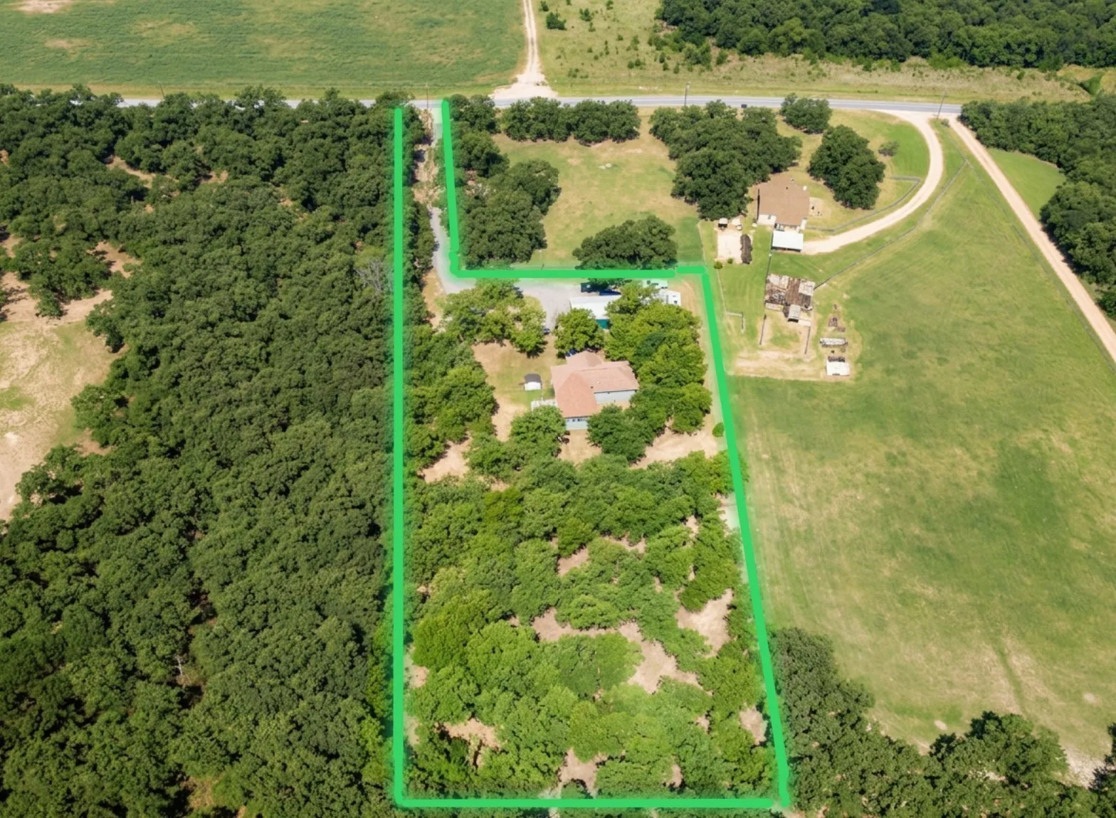 “2 private acres with home, shop, and wooded privacy”