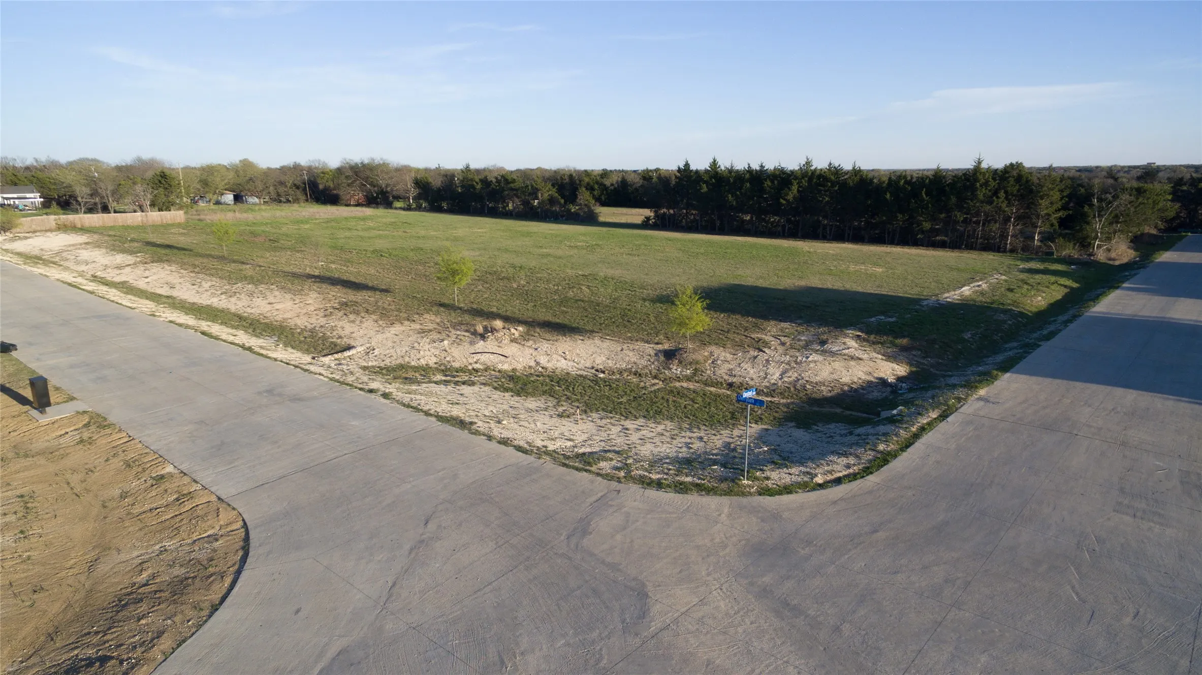 View of concrete road with a rural view