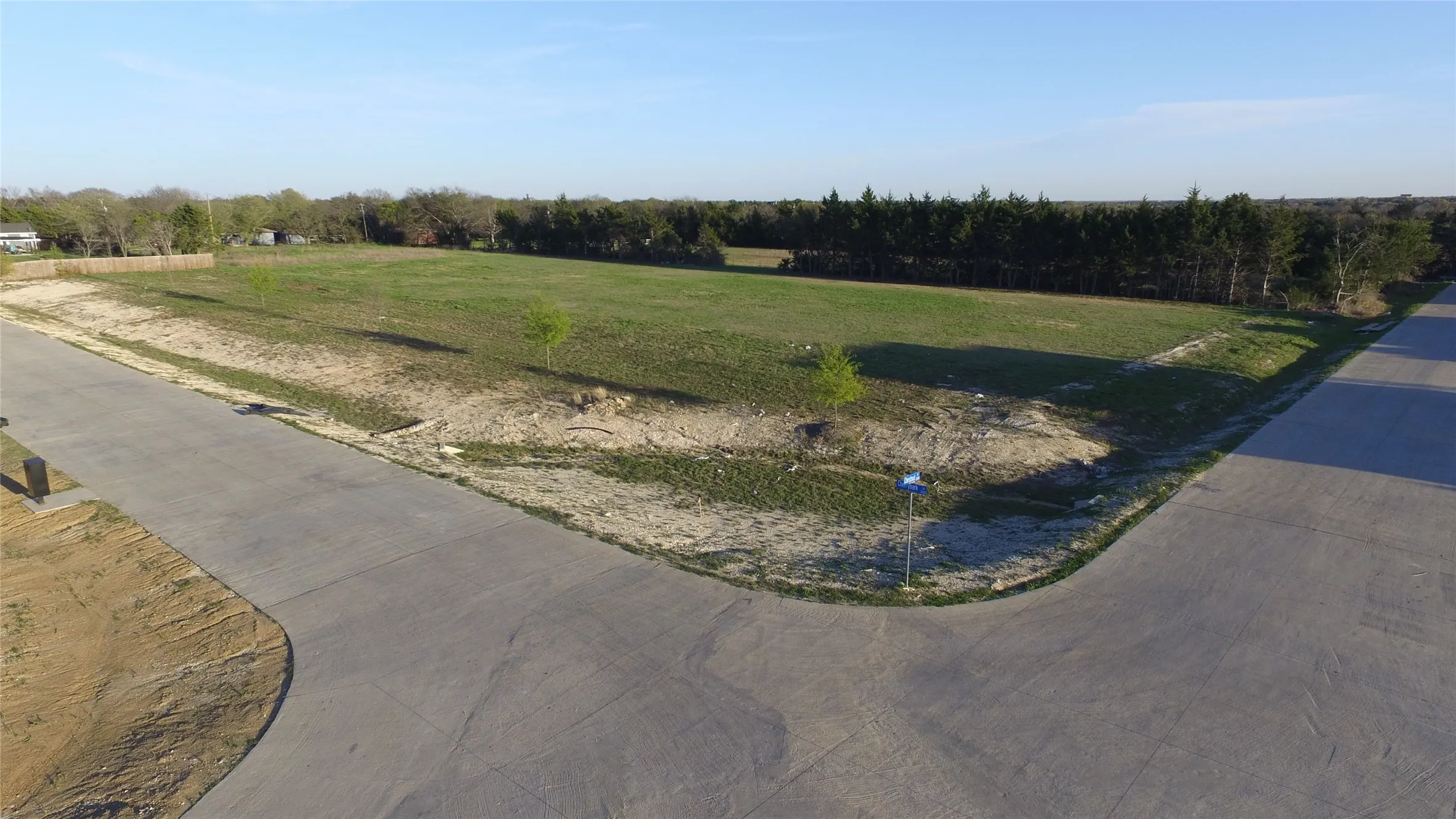 View of concrete road featuring a view of rural / pastoral area