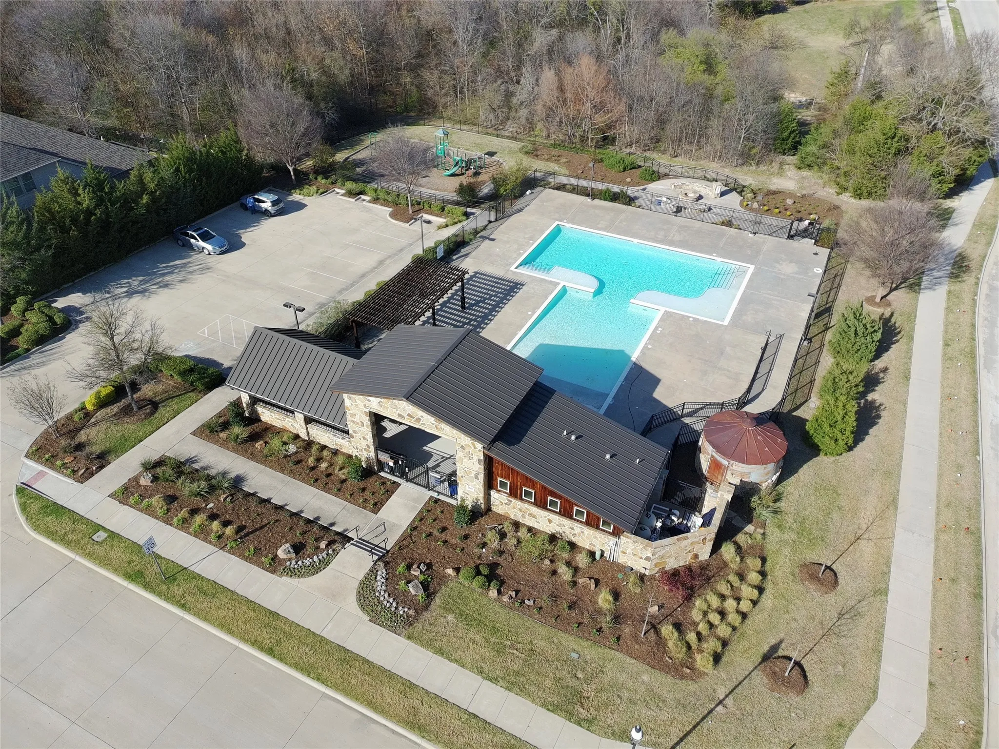 Community Center with pool, firepit, and playground