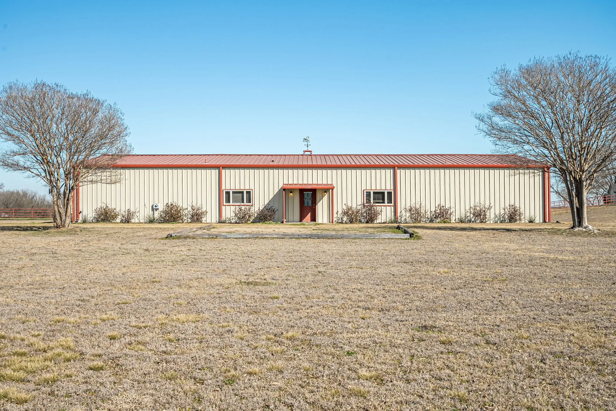 View of pole building featuring a yard