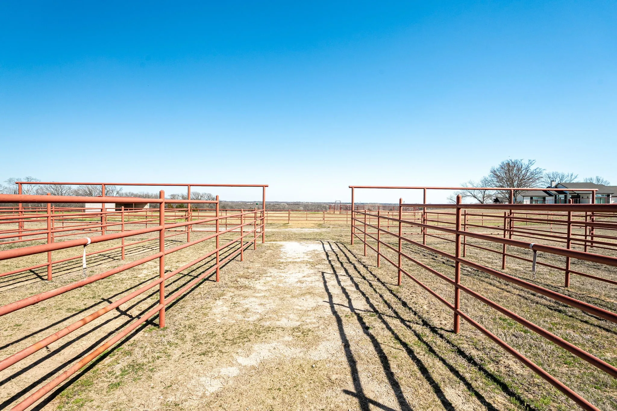 View of yard featuring a view of countryside, an outbuilding, and an exterior structure