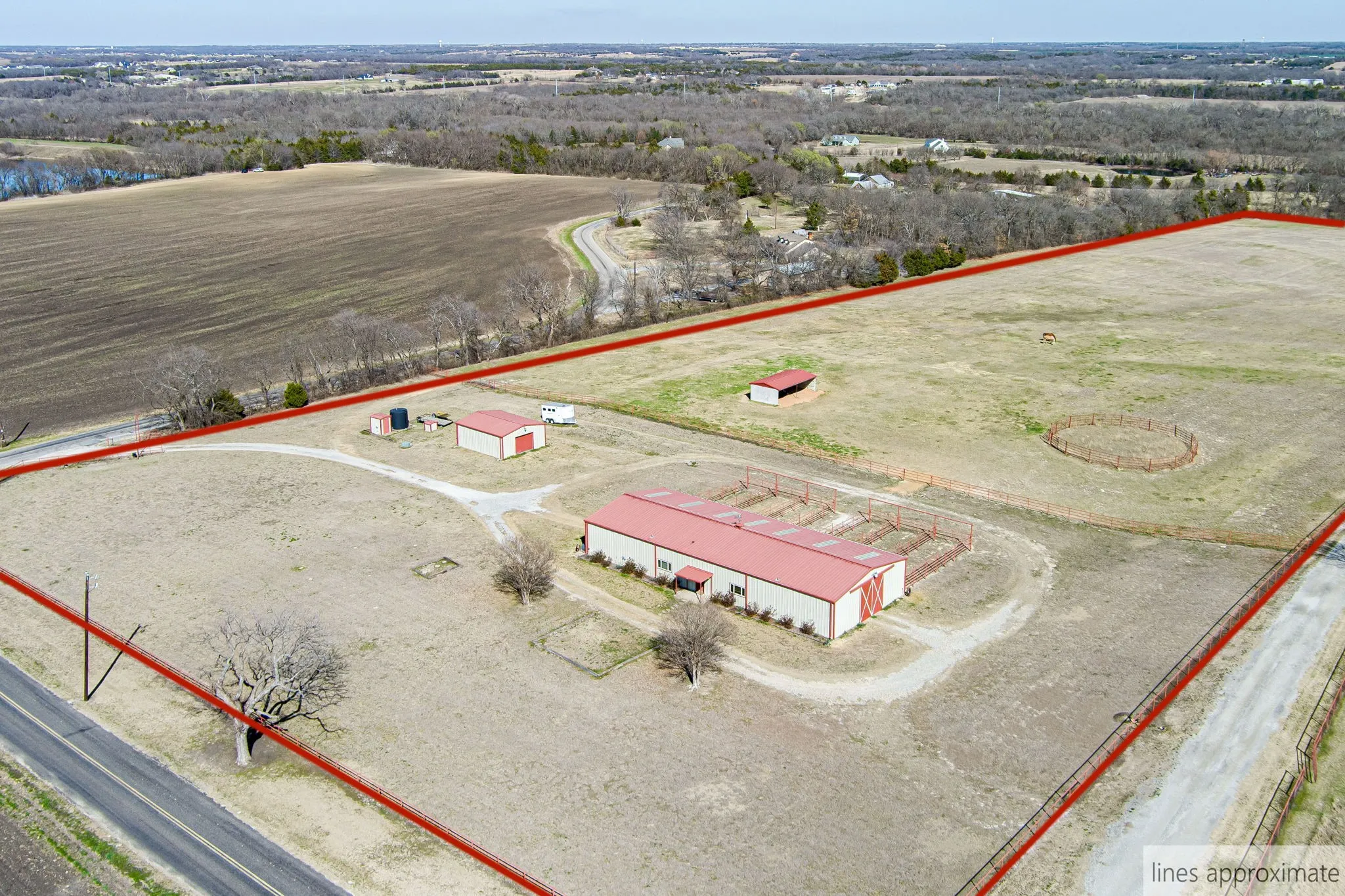 Aerial view of sparsely populated area featuring property boundaries highlighted
