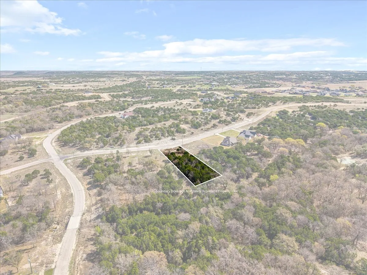 Aerial overview of property's location featuring property boundaries highlighted