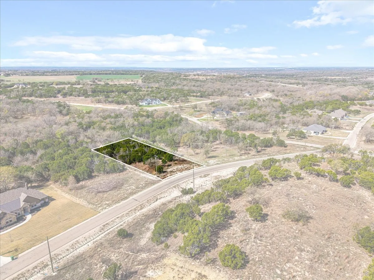 Aerial view of property's location featuring property parcel outlined