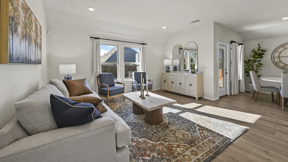 Living area with dark wood-style floors, recessed lighting, and lofted ceiling