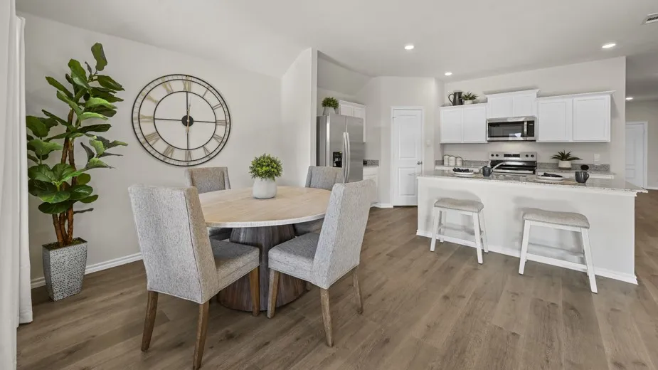 Dining room featuring light wood-style flooring and recessed lighting