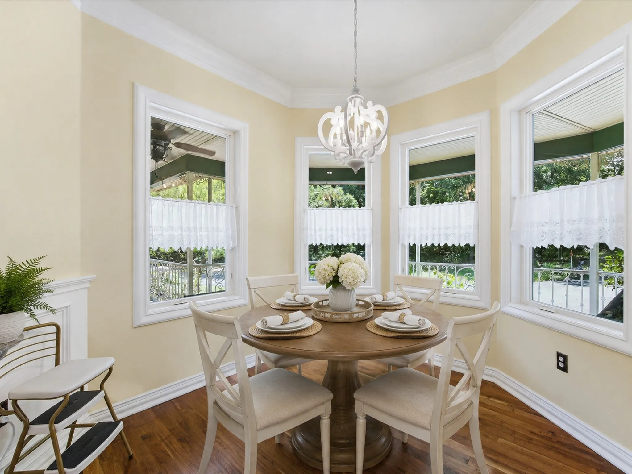 Bright dining area featuring hardwood flooring