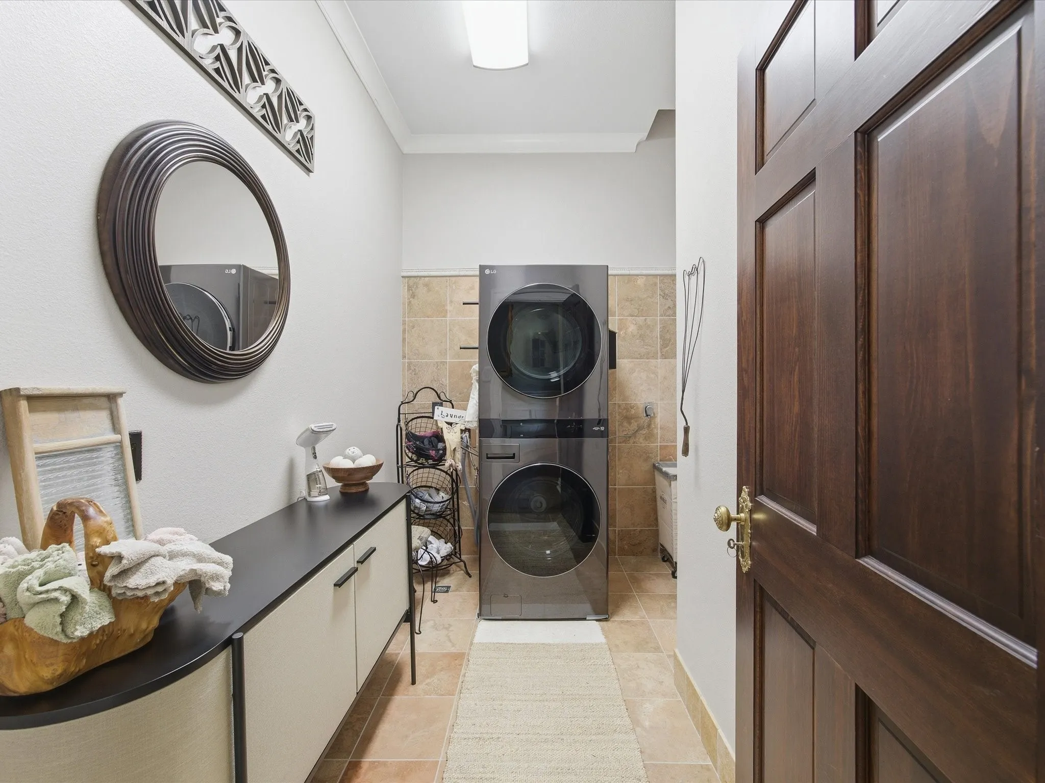 Laundry area featuring a laundry shoot for upstairs.