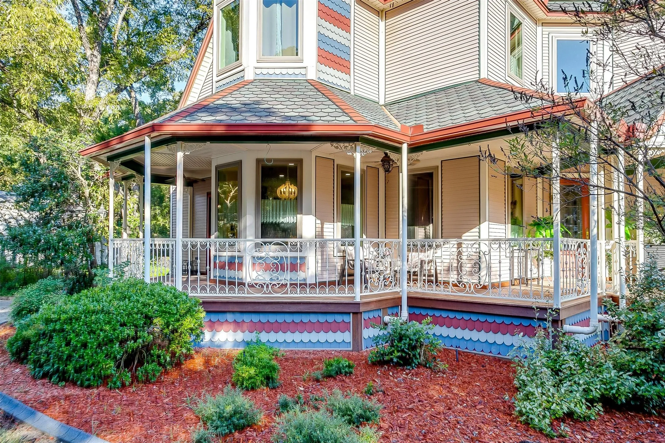 Front of property with covered porch and landscaping