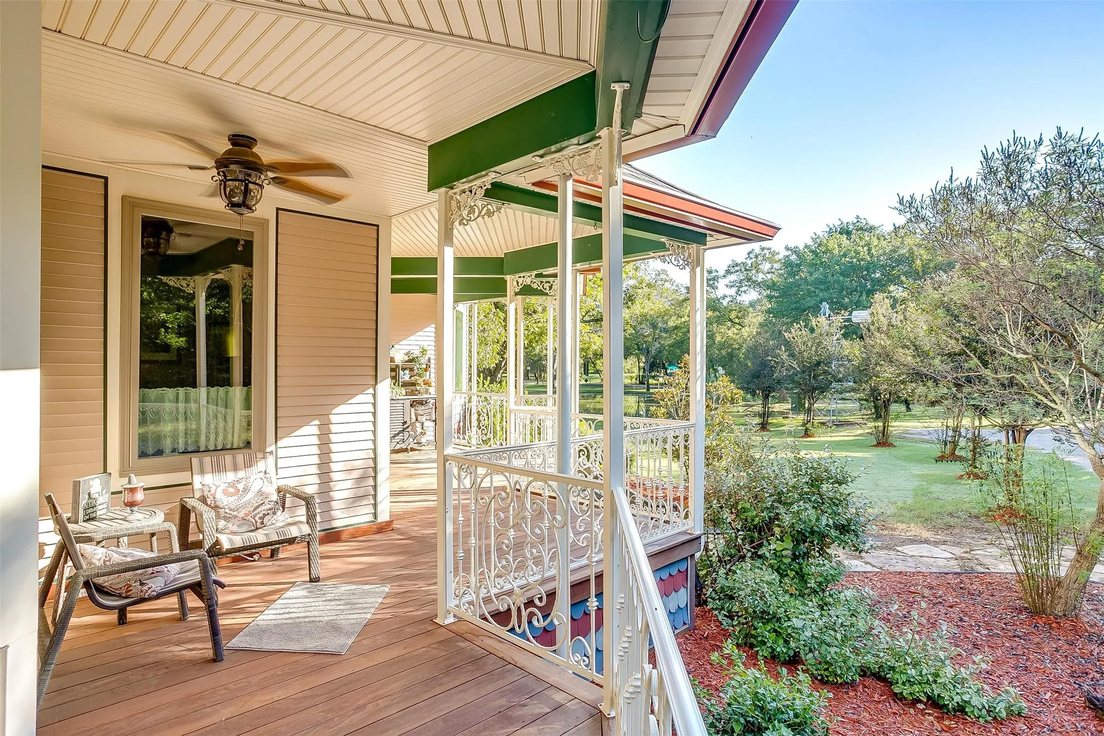 View from covered porch of front lawn and landscaping