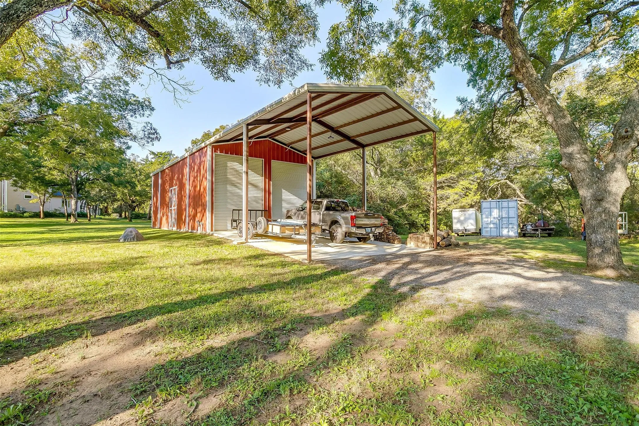 Large insulated shop plus RV/boat storage with oversized bay doors, ideal for equipment, storage, hobbies, or operational support