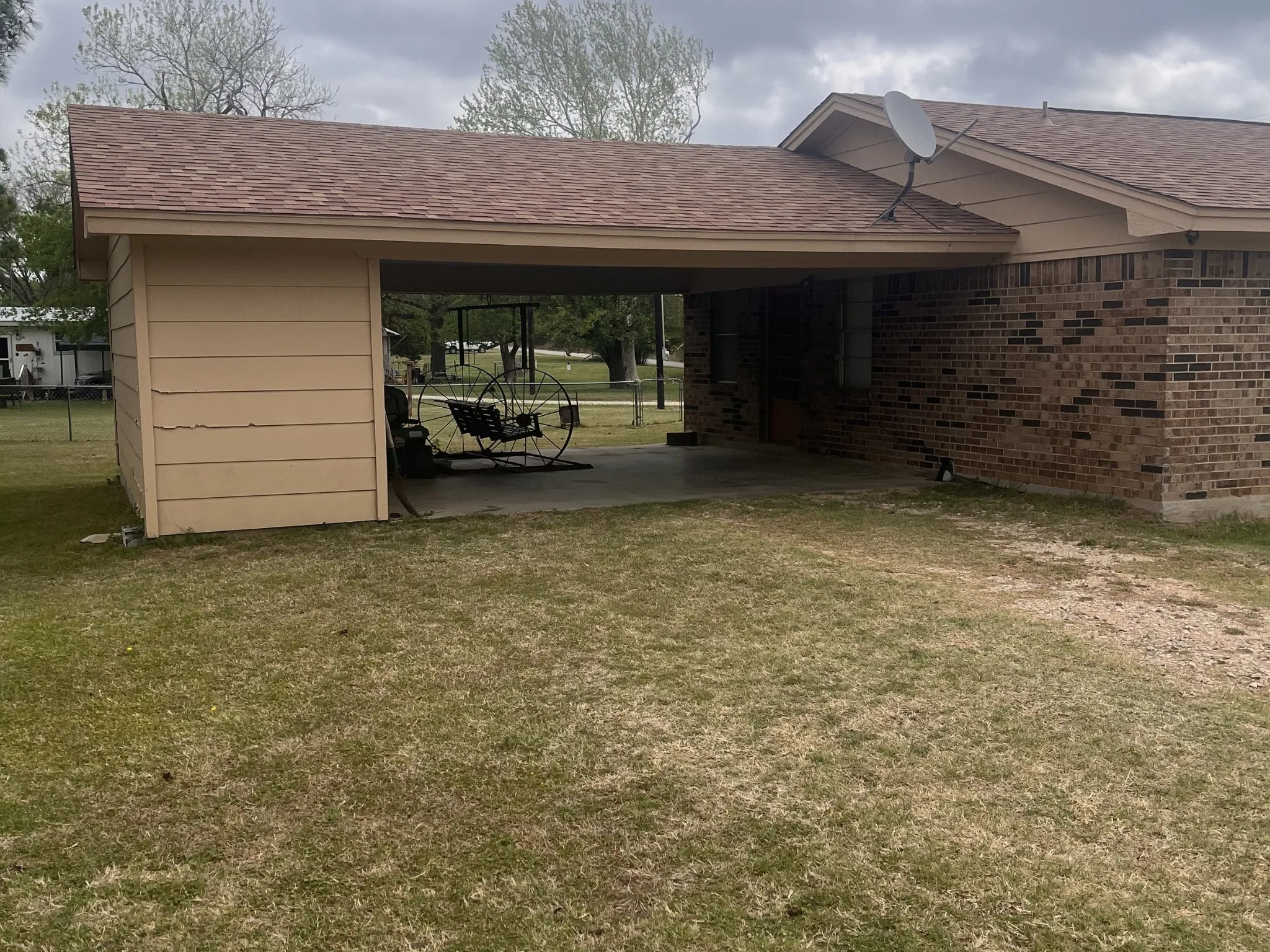 Carport attached to Brick Home