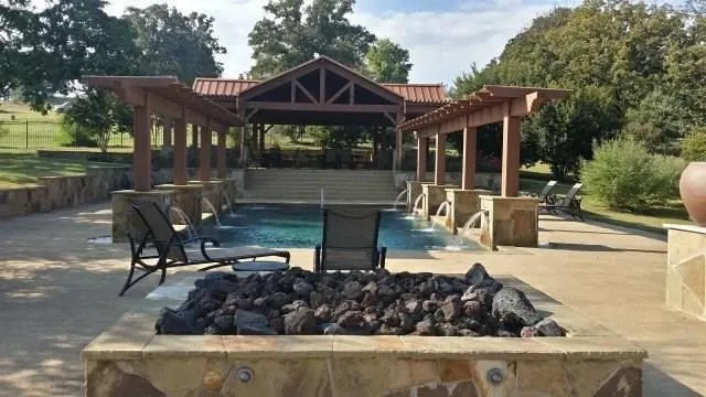 View of patio with a gazebo and an outdoor pool