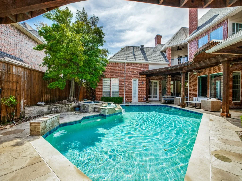 Pool, spa, and waterfall.