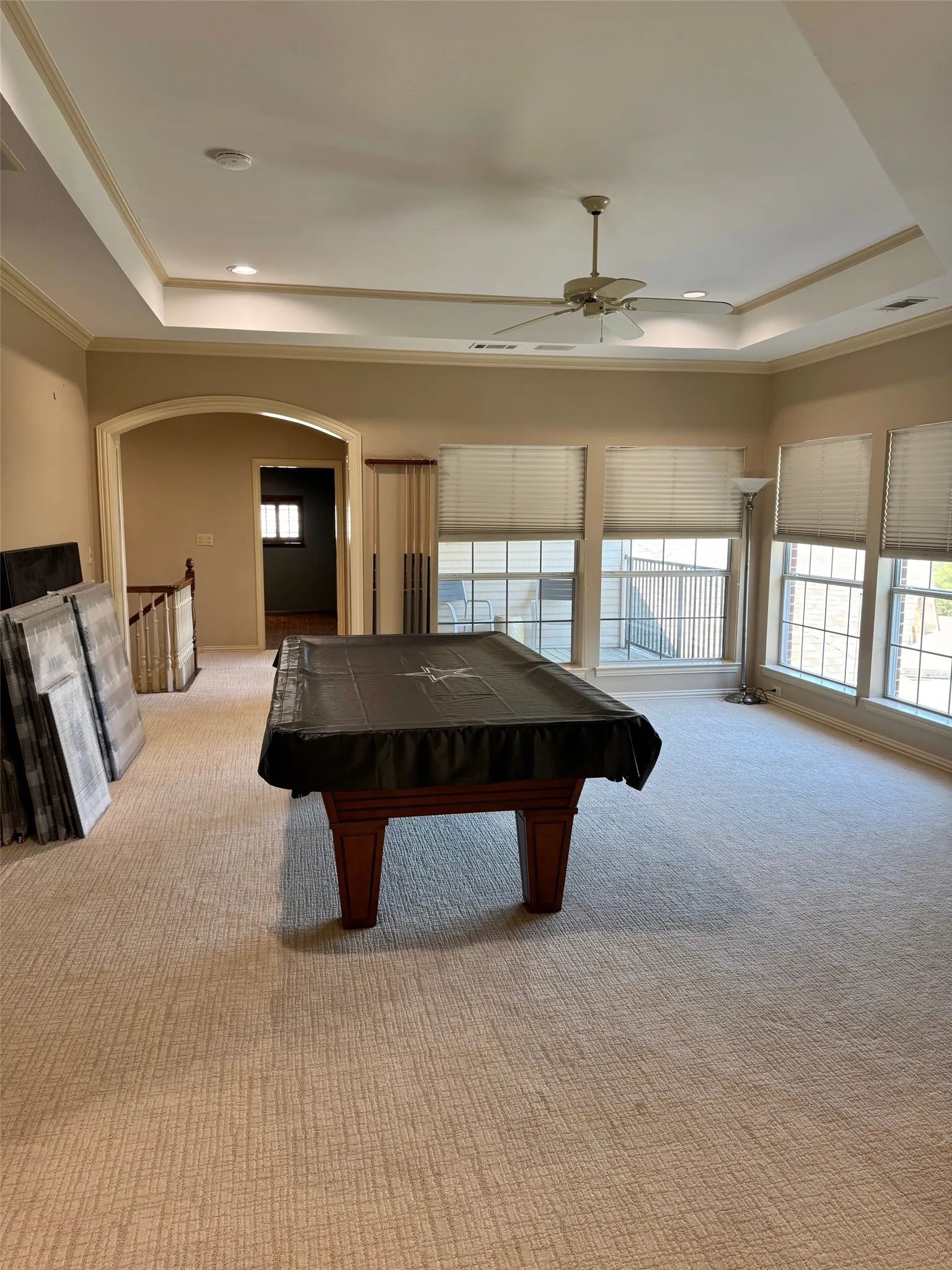 Open area game room with built in desk.