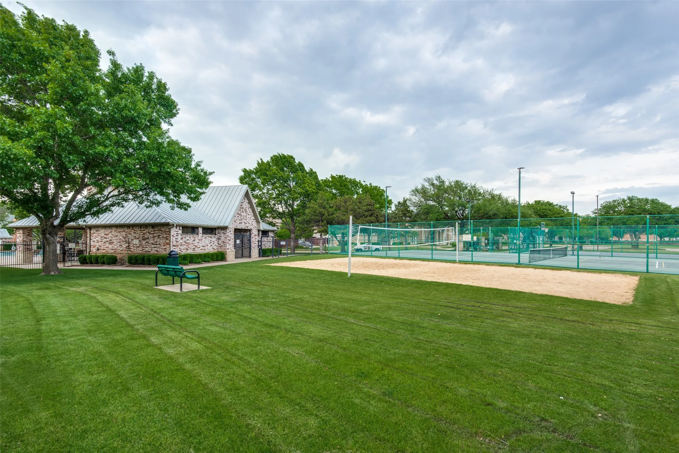 Tennis court and clubhouse included in Lakeside on Preston amenities.