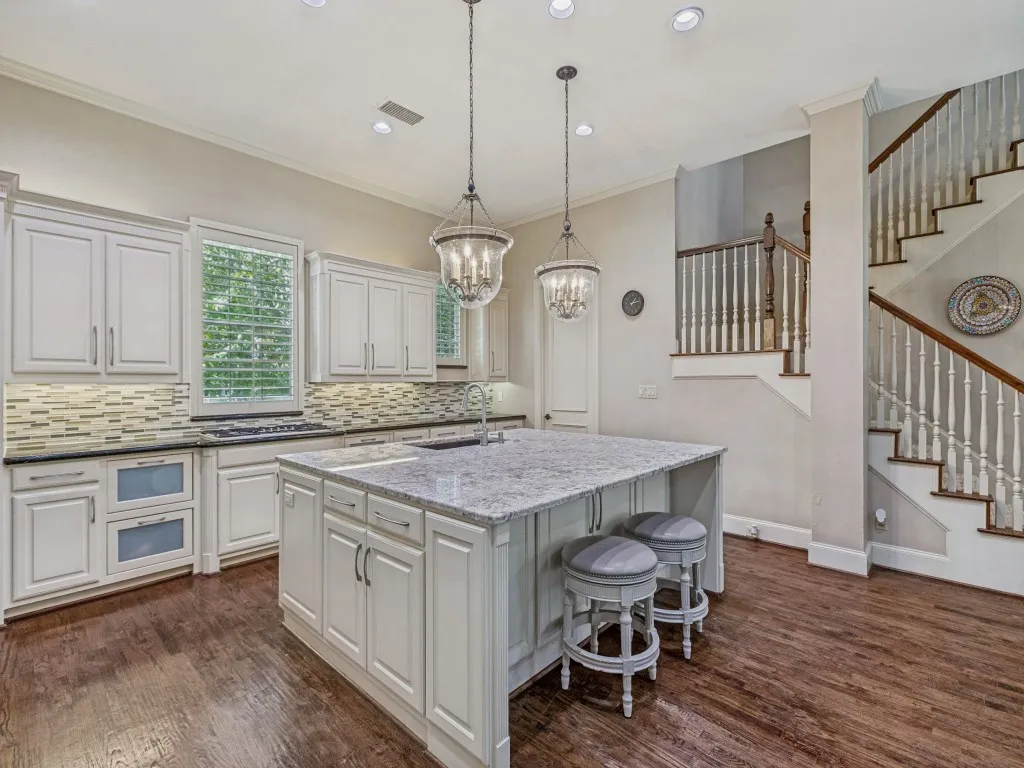 Large center island and back set of stairs.