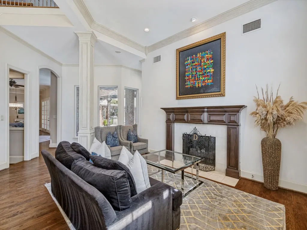 Living room with see through fireplace to office.
