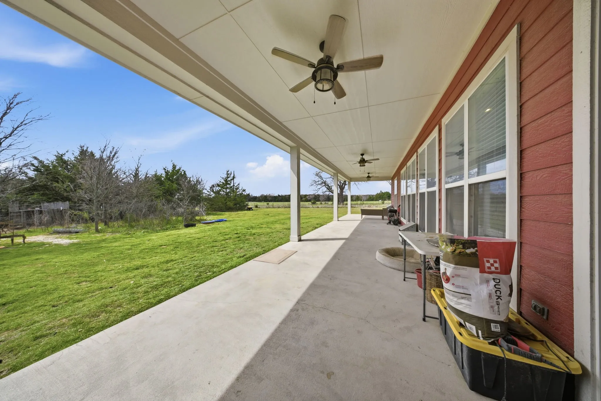 View of patio featuring a ceiling fan