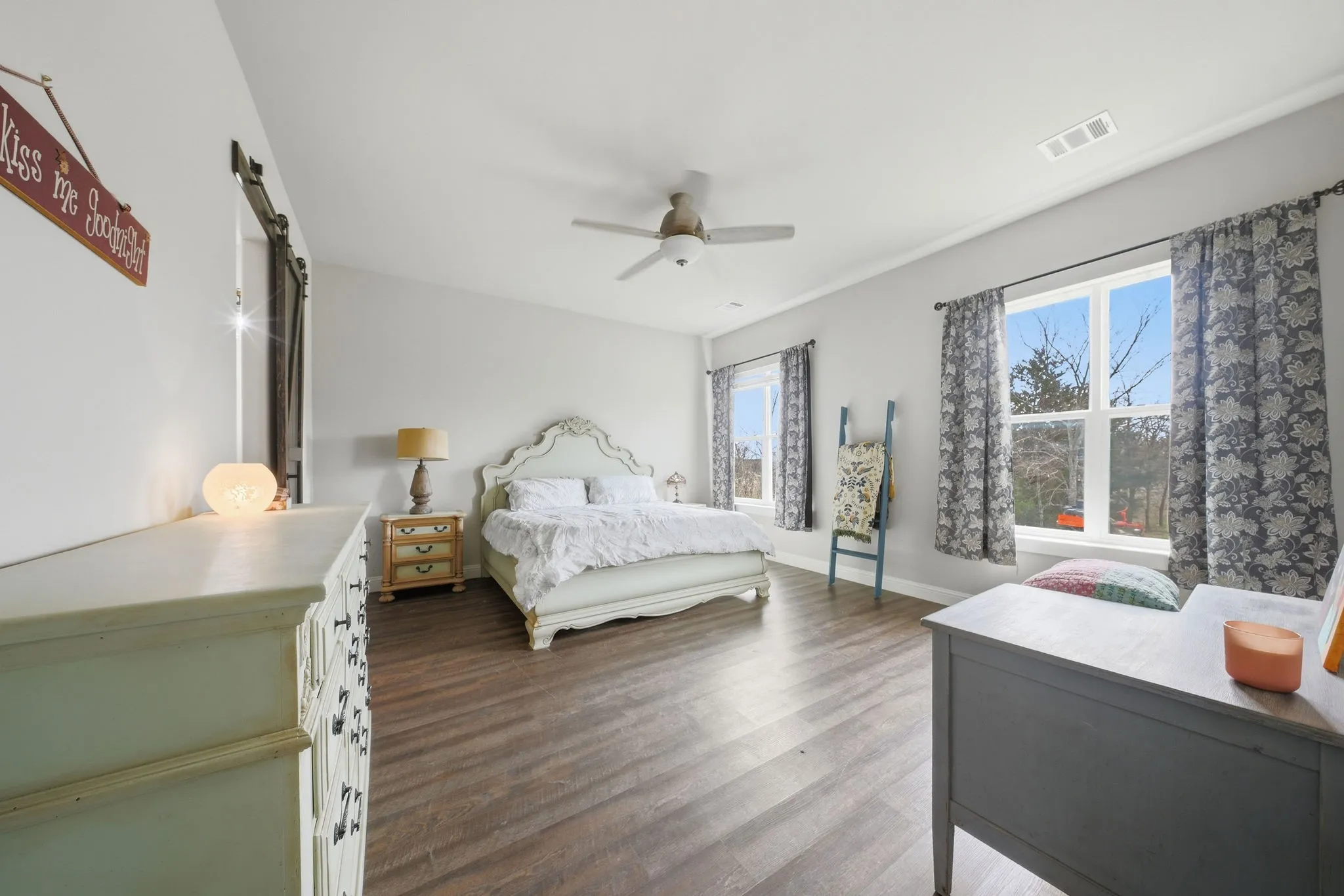 Bedroom featuring dark wood-style floors and ceiling fan