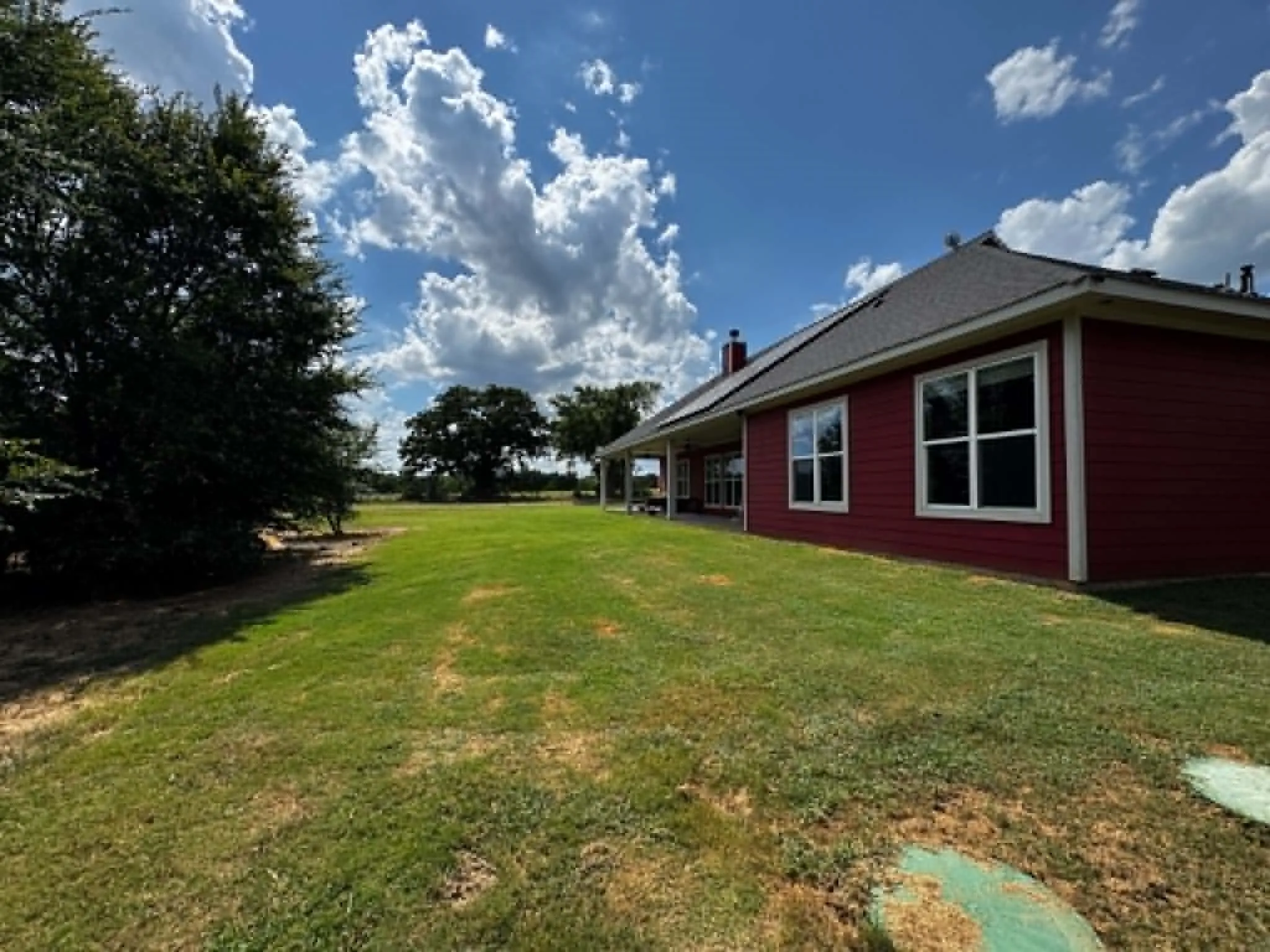 Red horizontal siding exterior with white trim