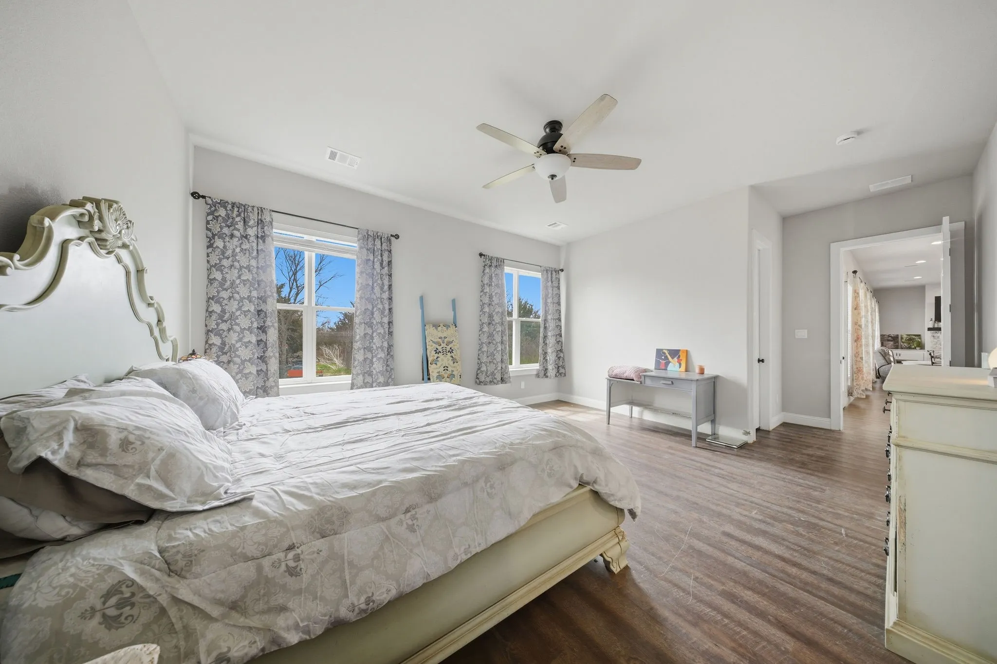 Bedroom featuring dark wood finished floors and ceiling fan