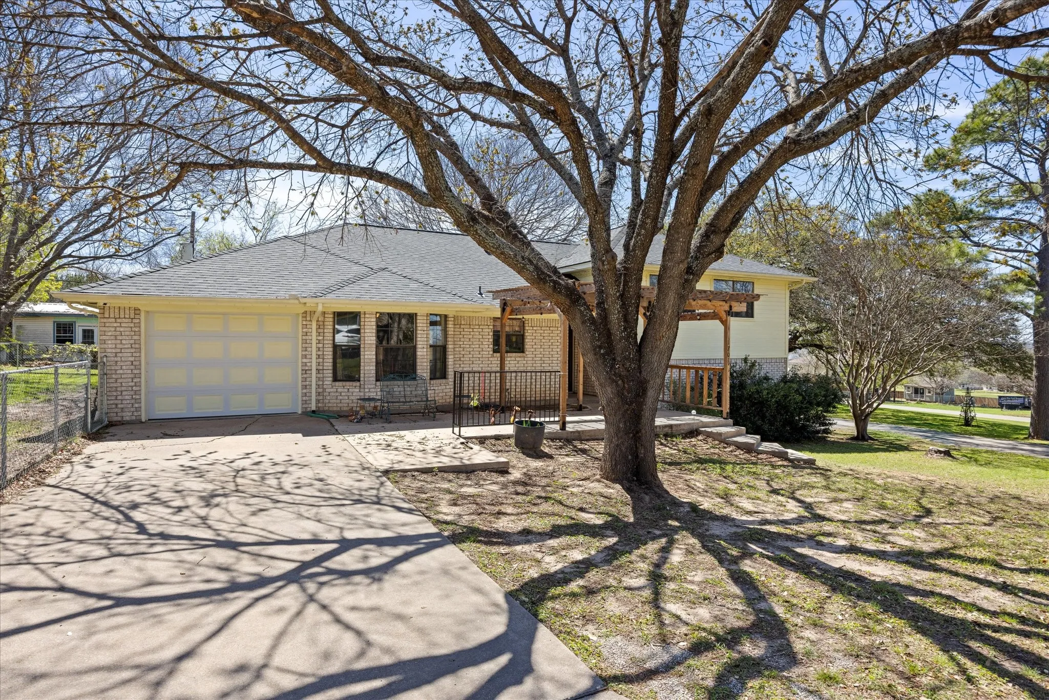 This corner lot has beautiful, mature trees that will provide wonderful shade for you